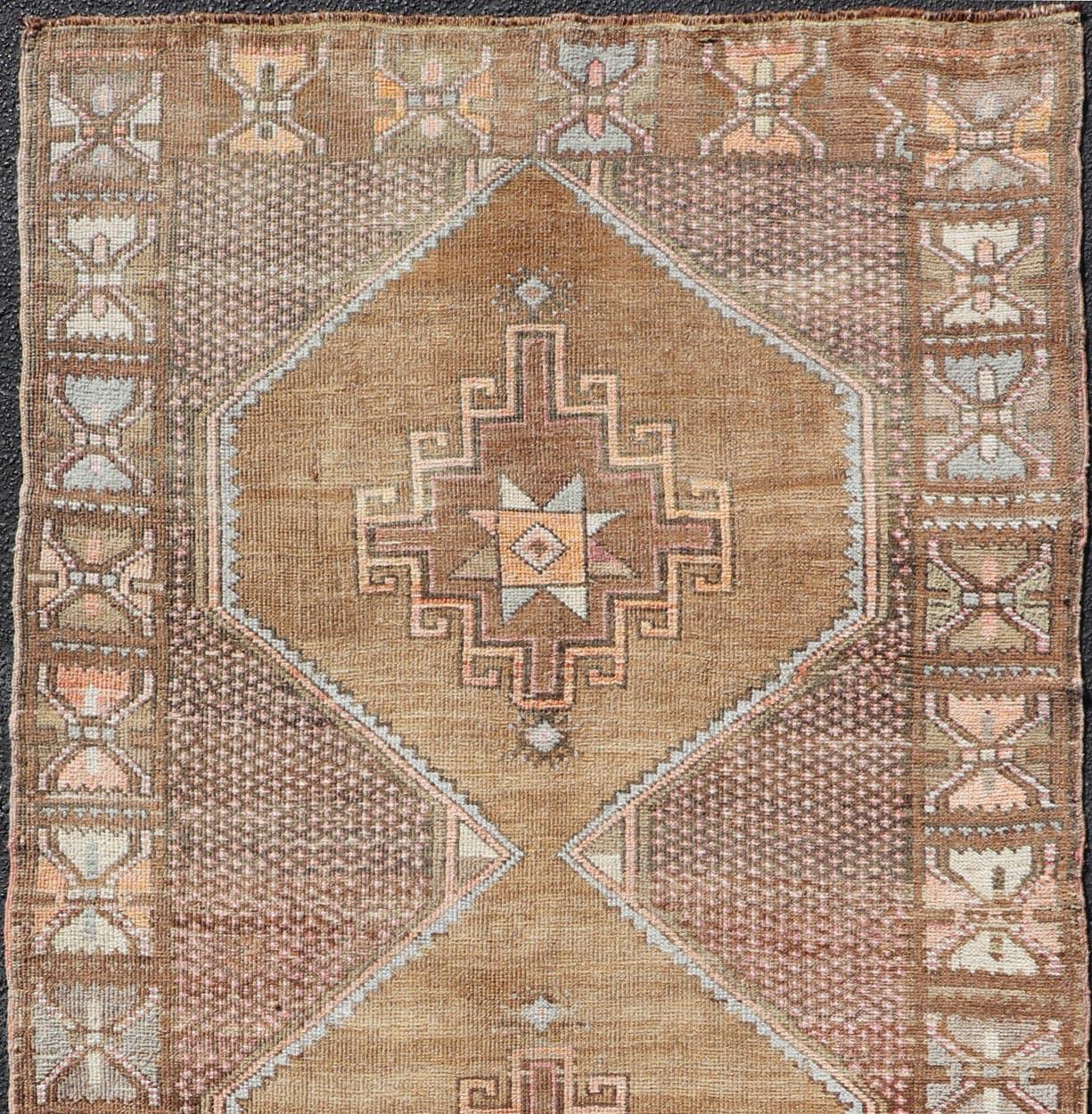 Vintage Turkish runner in Brown background, accent colors, soft red, tan, green, light blue, taupe, rug/TU-MTU-4956, country of origin / type: Turkey / Oushak, circa 1940

Measures: 4'1 x 8'10.