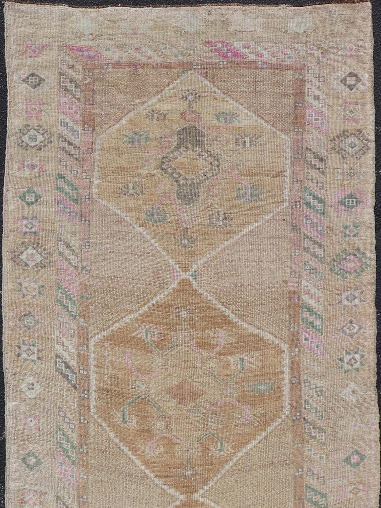Vintage Turkish runner in Brown background, accent colors, tan, green, light blue, taupe, Keivan Woven Arts / rug/TU-MTU-121, country of origin / type: Turkey / Oushak, circa 1940

Measures: 4'3 x 11'8.