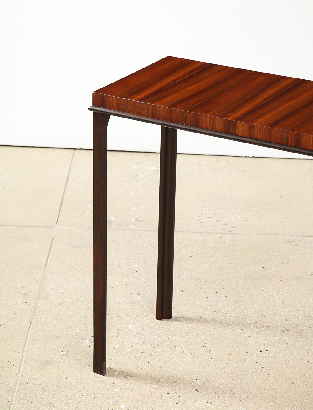 One-of-a-kind, super refined console table designed by Eugene Schoen and made by Schmeig & Kotzian. Created as part of an entire home for the Cafritz family in Wash. DC 1937. The top has figured ribbon mahogany with inlaid stripes of rosewood.