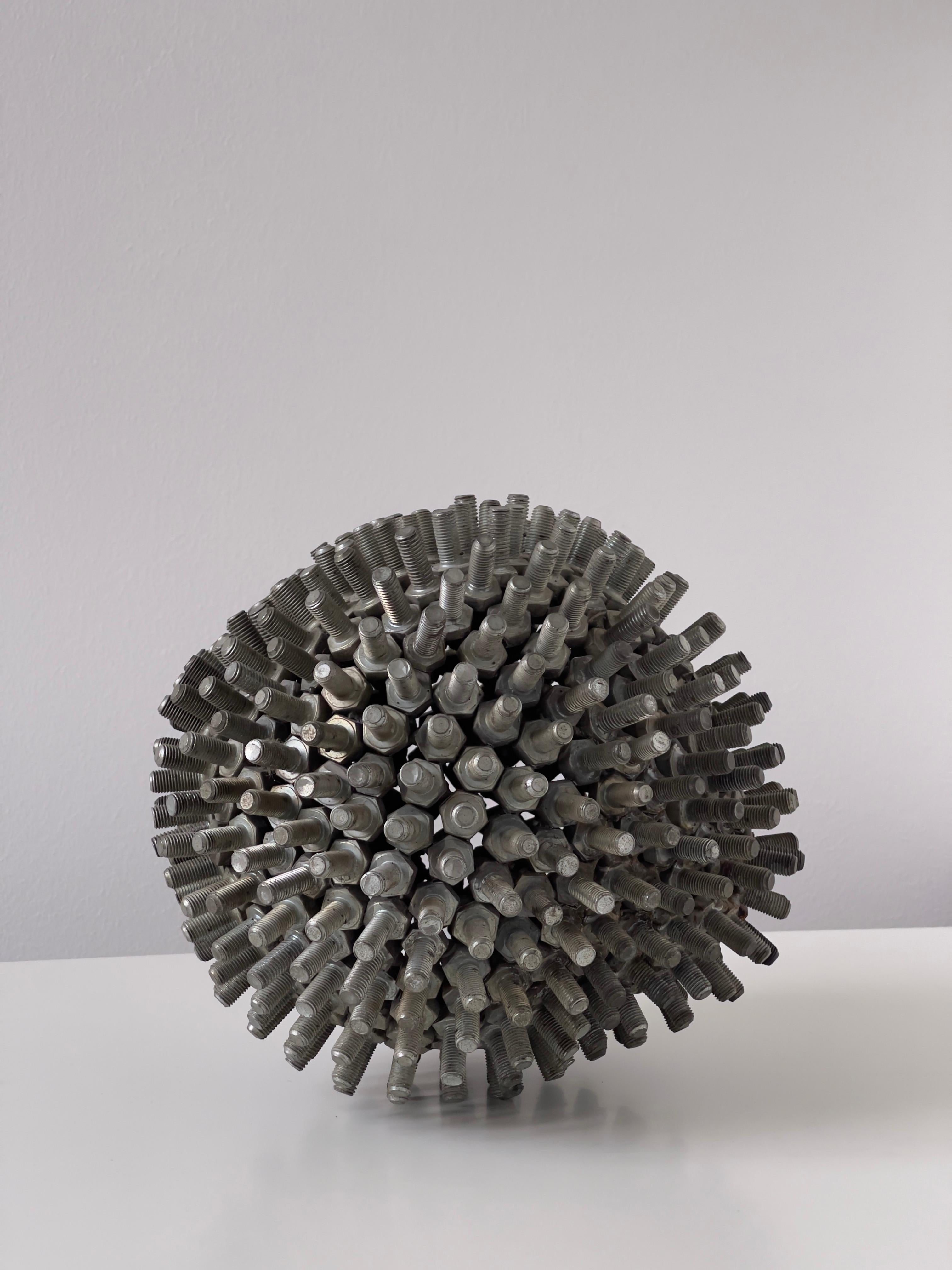 Metal Anonymous late 20th Century European modern sculpture. Sphere of metal bolts. For Sale