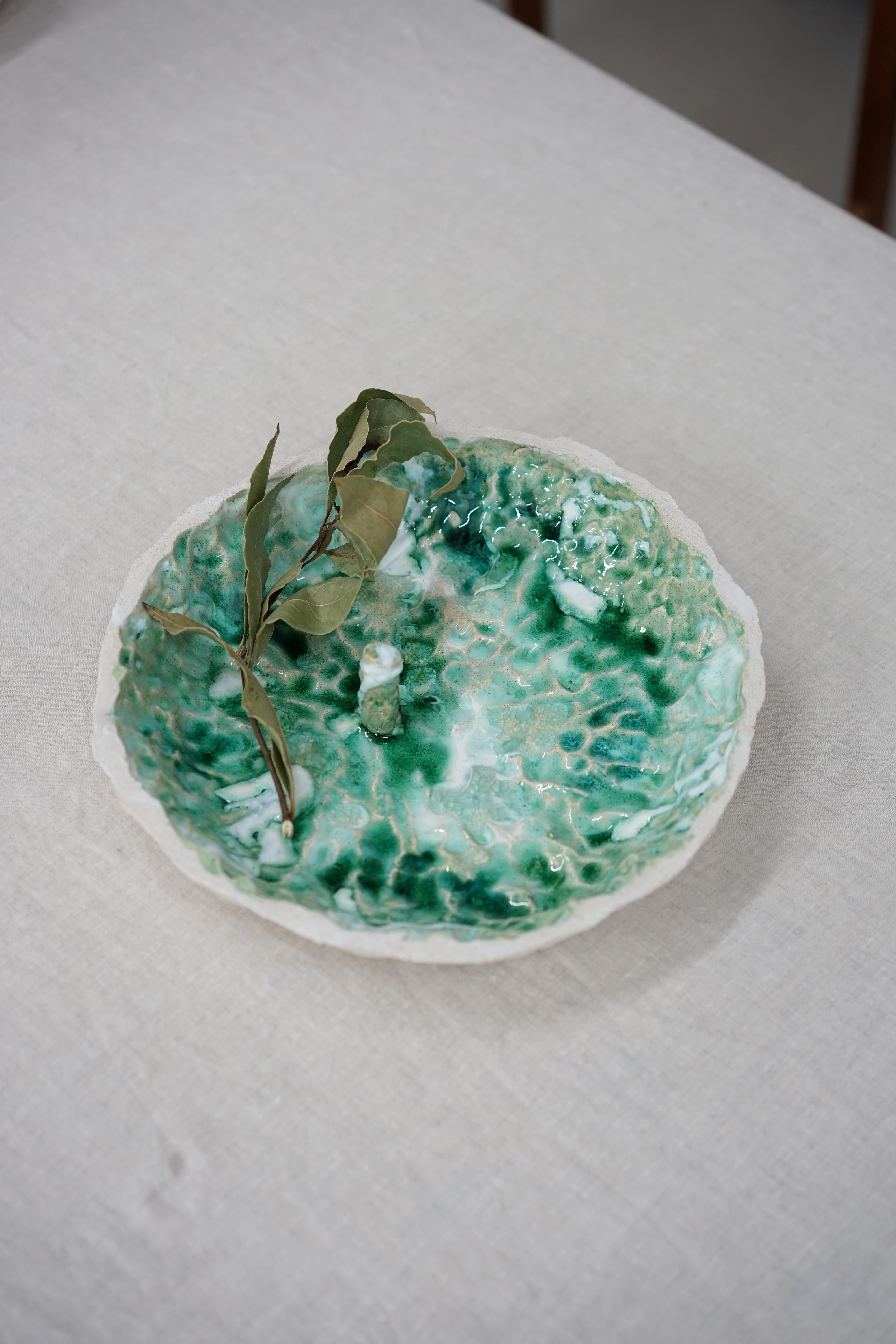 Unique Coupelle_Otoma_07 bowl by Emmanuelle Roule
Unique piece
Dimensions: D 38 x H 6 cm
Materials: stoneware, glass

Unique piece modelled in white stoneware, with glazes. Made in 4 firings.

Creative studio founded in 2007 in