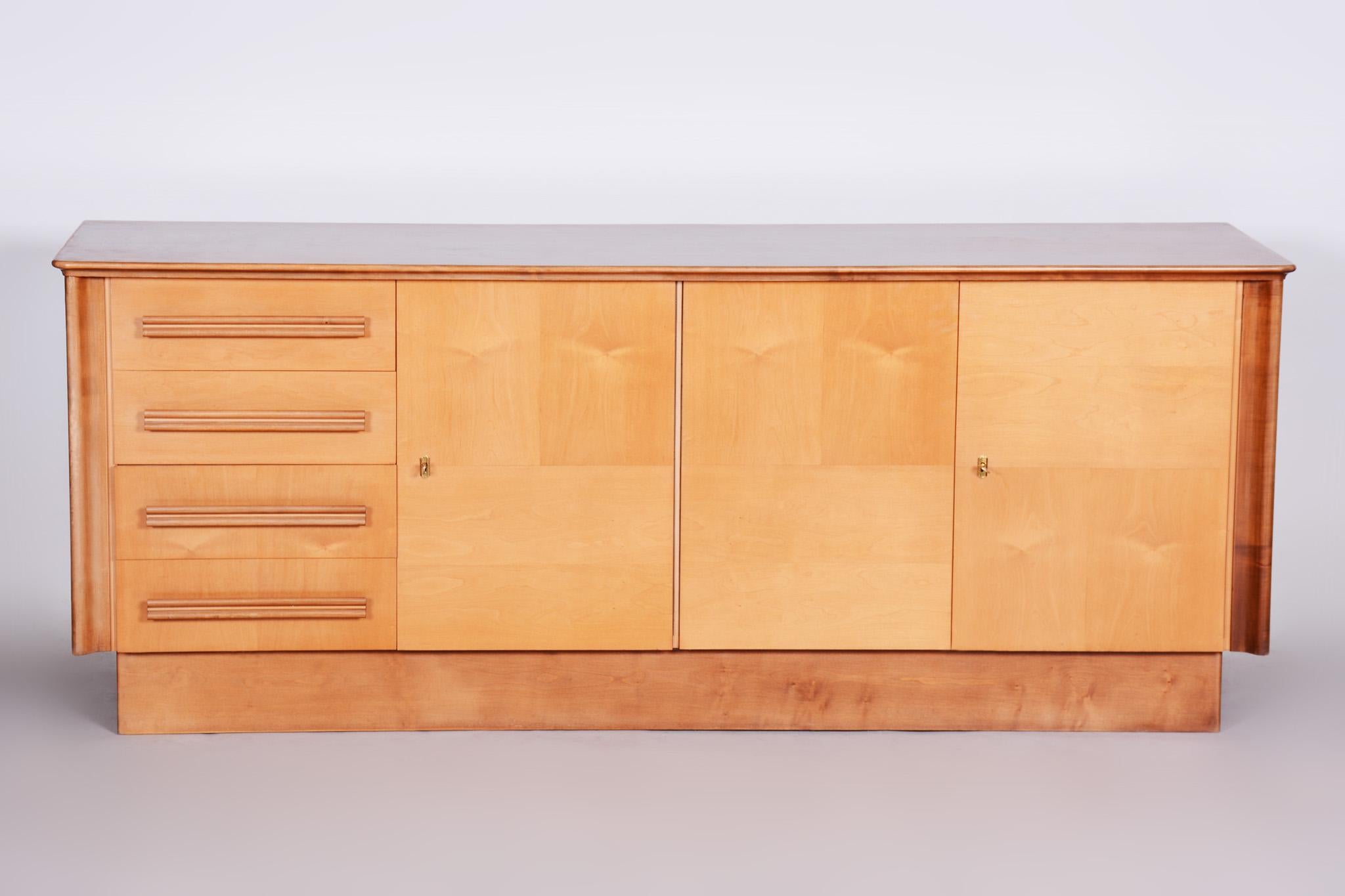 Czech Mid-Century sideboard.

Material: Maple 
Original very well preserved condition

We guarantee safe a the cheapest air transport from Europe to the whole world within 7 days.
The price is the same as for ship transport but delivery time