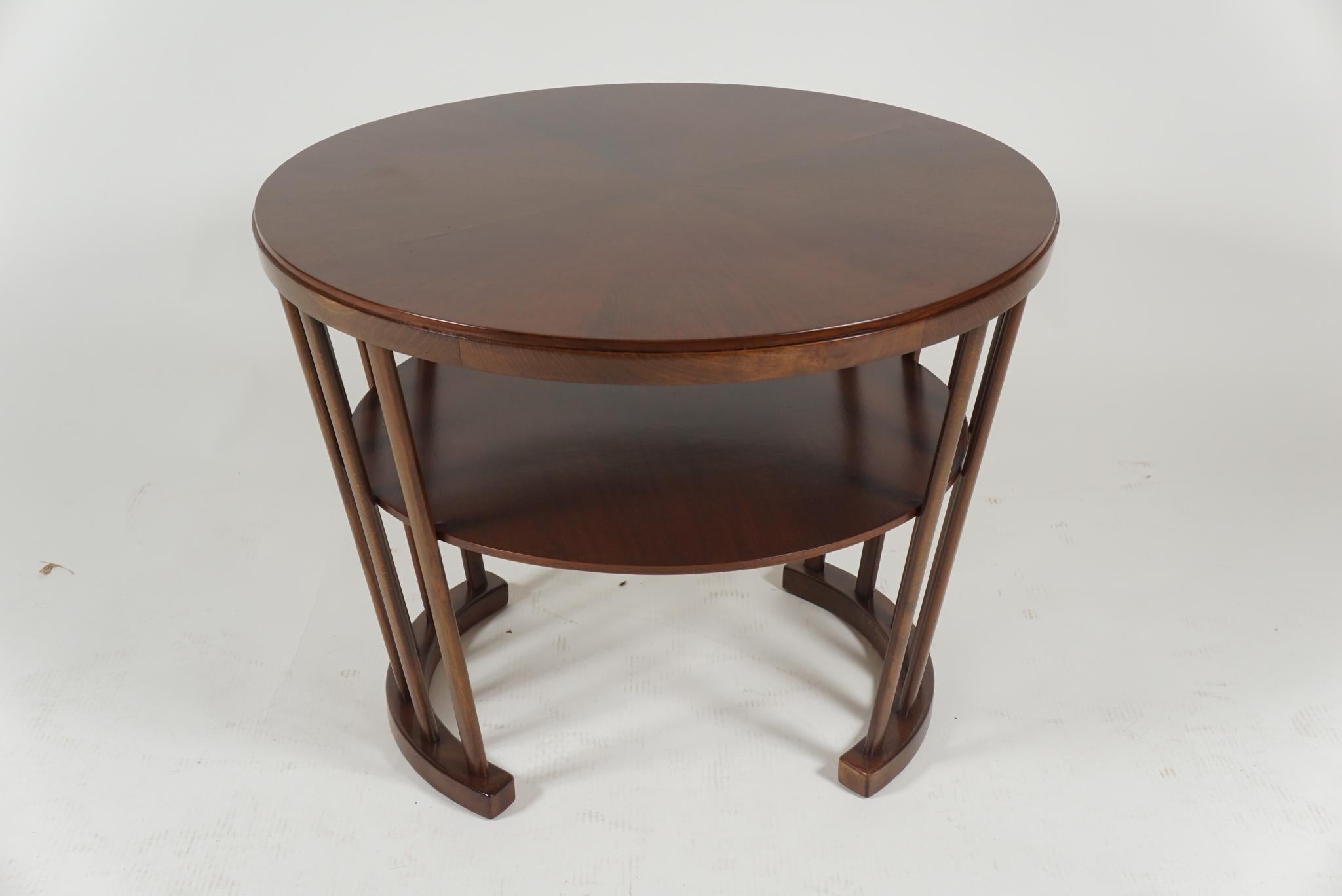 Unique design round side table, Danish modern, in rosewood, could be used as lamp table or tea or coffee table.
 