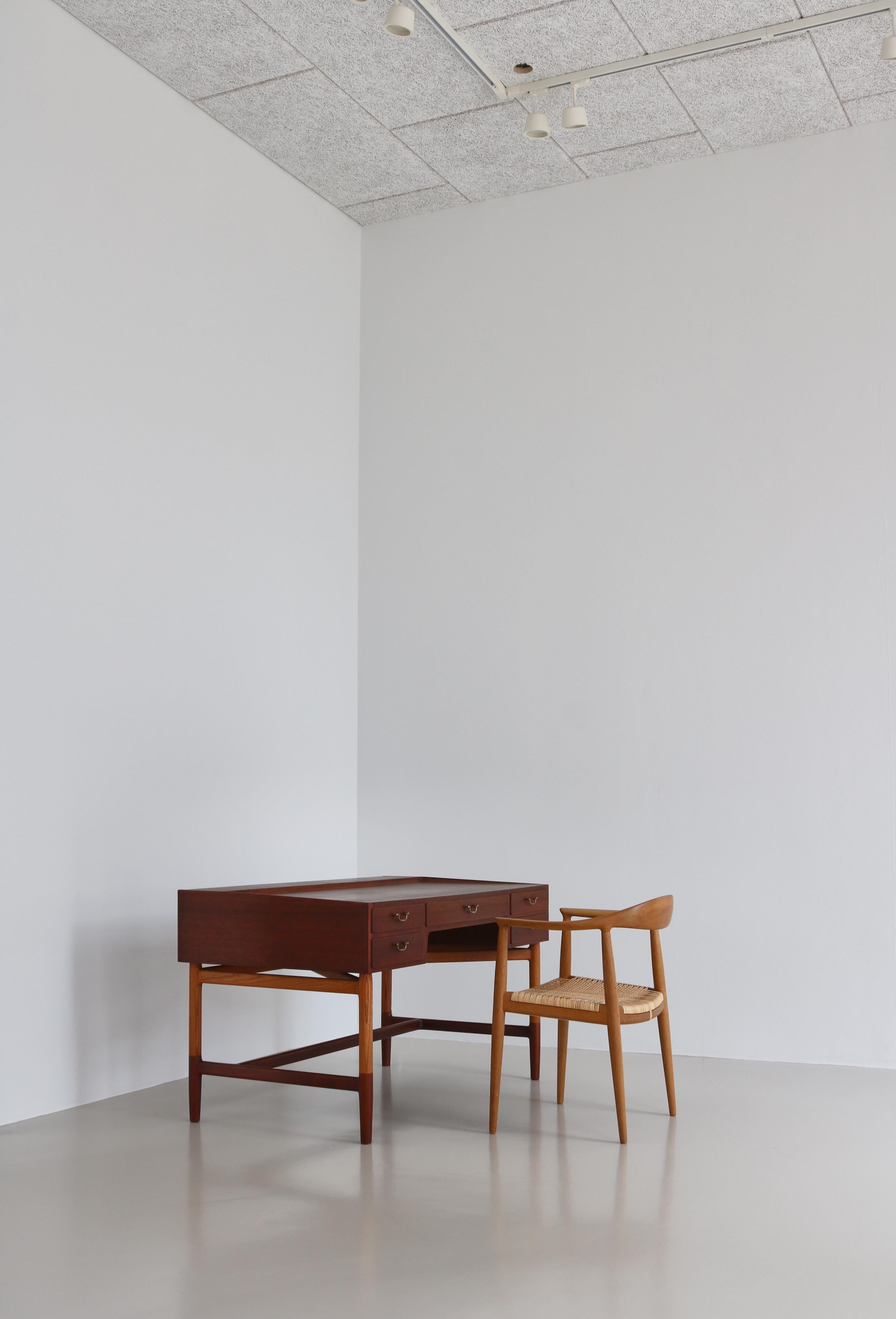 Amazing freestanding work desk by Danish designer Kurt Østervig made for himself in the early 1950s. Østervig needed a desk that suited his own needs and came up with this unique design. The table is constructed so Østervig could be seated on one