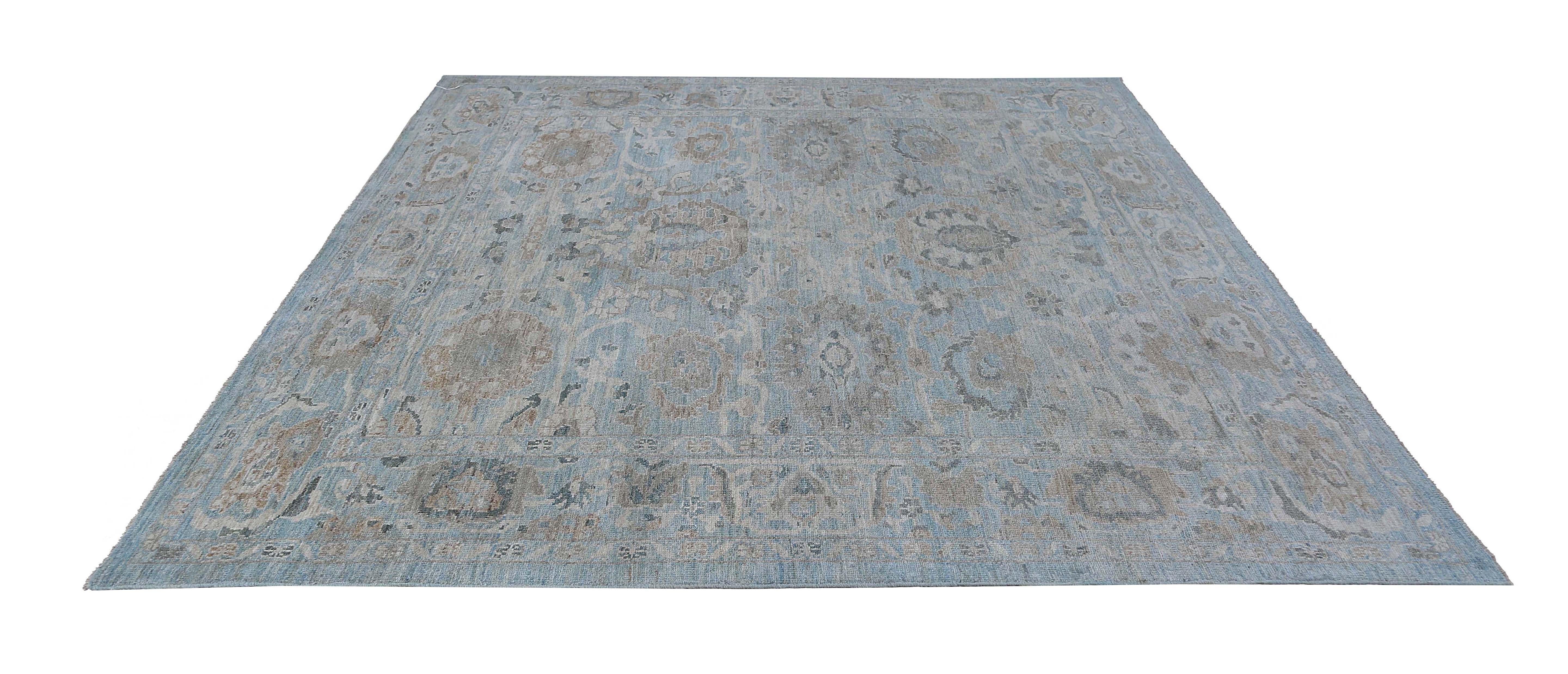 Introducing our luxurious 8'4'' x 8'6'' Sultanabad rug, handwoven from premium quality wool to provide a soft and comfortable underfoot experience. The rug's intricate design features a dark blue background with a stunning blend of floral and