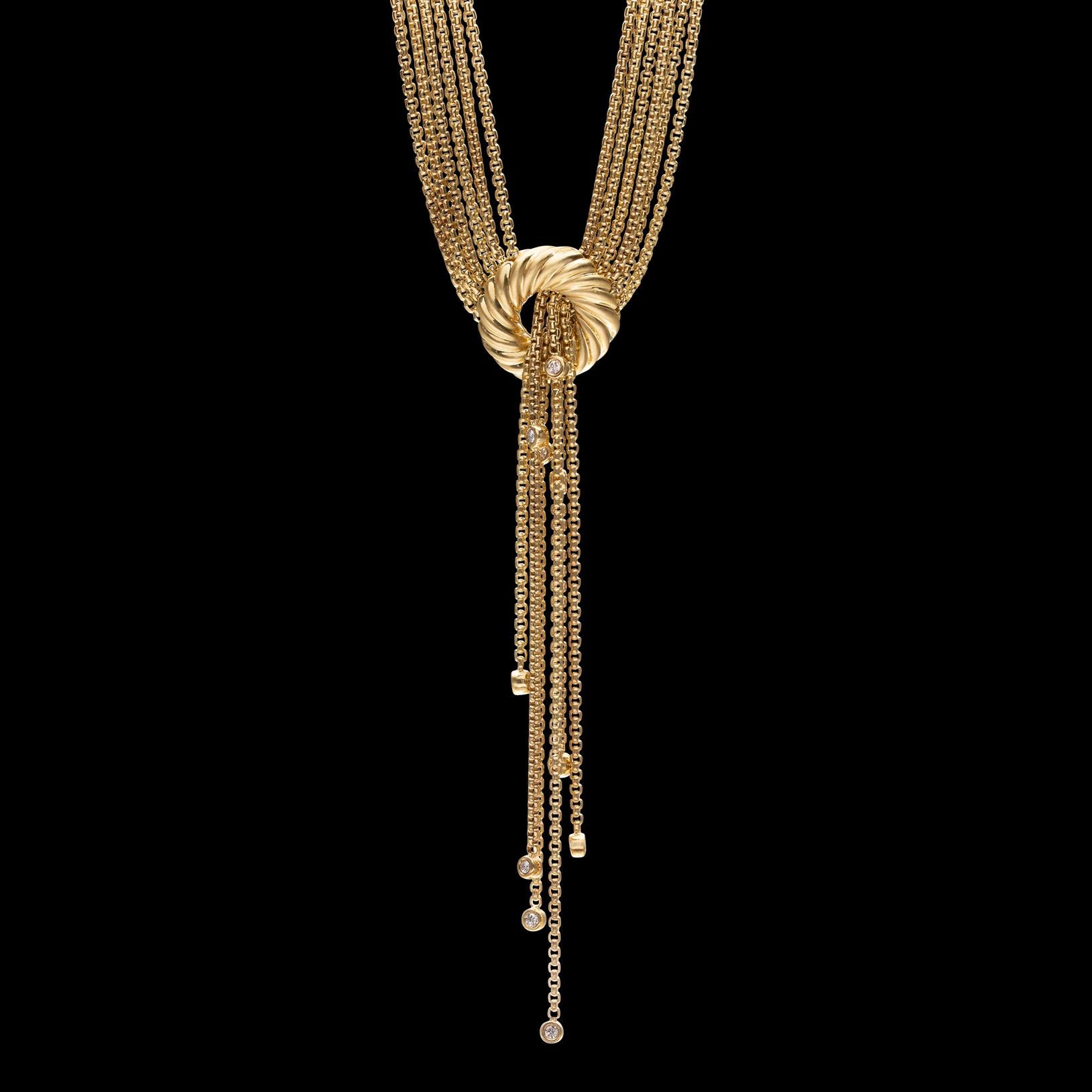 Unique and hard to find David Yurman necklace! The 18k gold tassel lariat necklace is designed with 6-rows of gold box-style chain, pulled through a fluted, round clasp, the tassels graduated and bezel-set with 10 round-cut diamonds, totaling