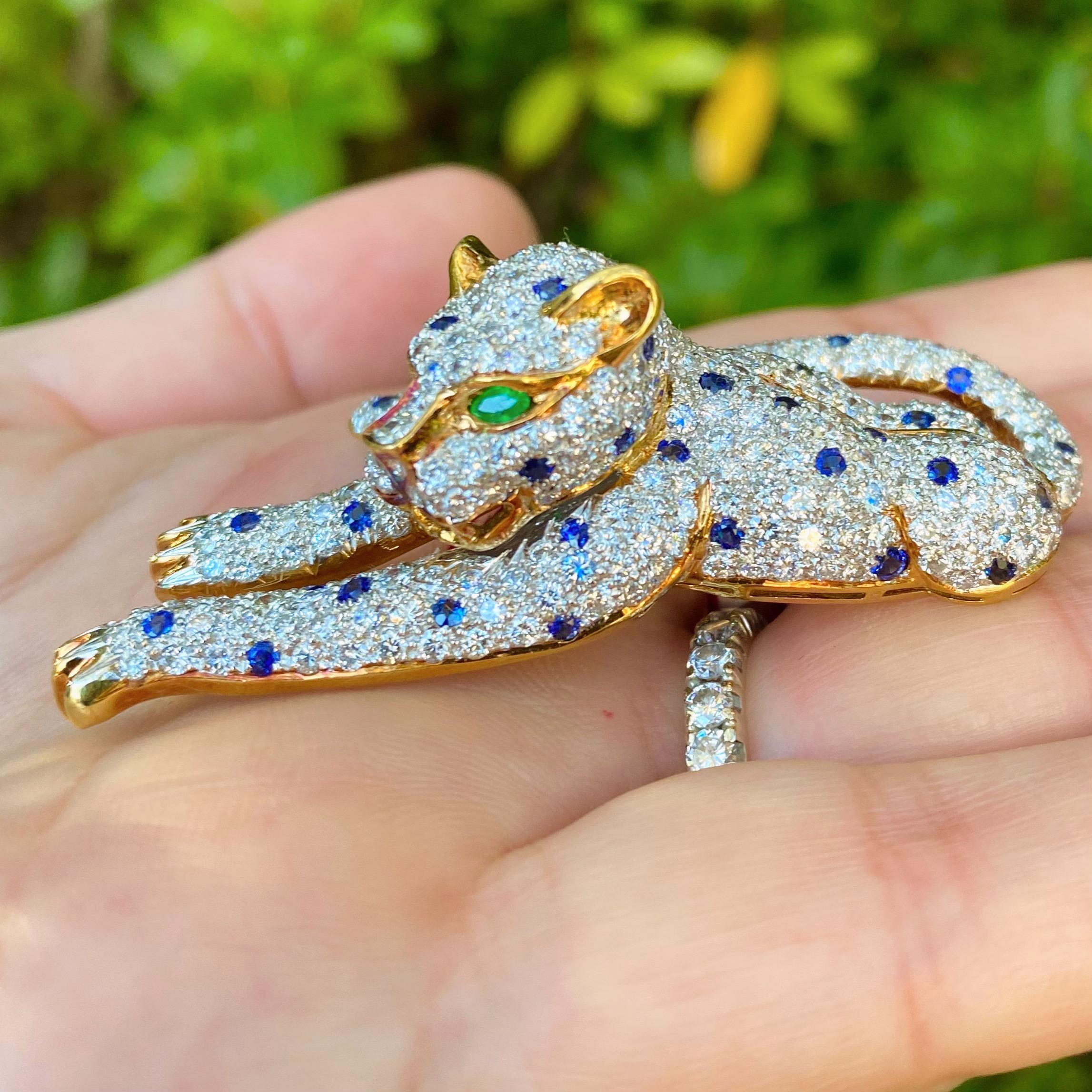A truly extraordinary piece of jewelry designed for someone who appreciates the finer things. This 18 karat gold leopard brooch features approximately 7.30 carats of fine white diamonds expertly set to create one incredible design. With blue