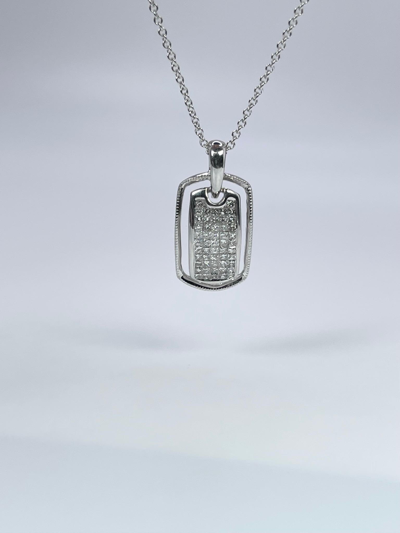 Rectangular pendant made with diamonds in a unique invisible setting style, the pendant is set so that there is no gold all you see are diamonds. The metal is 18KT white gold. The pendant is unisex.

GRAM WEIGHT: 2.98gr
GOLD: 18KT white
