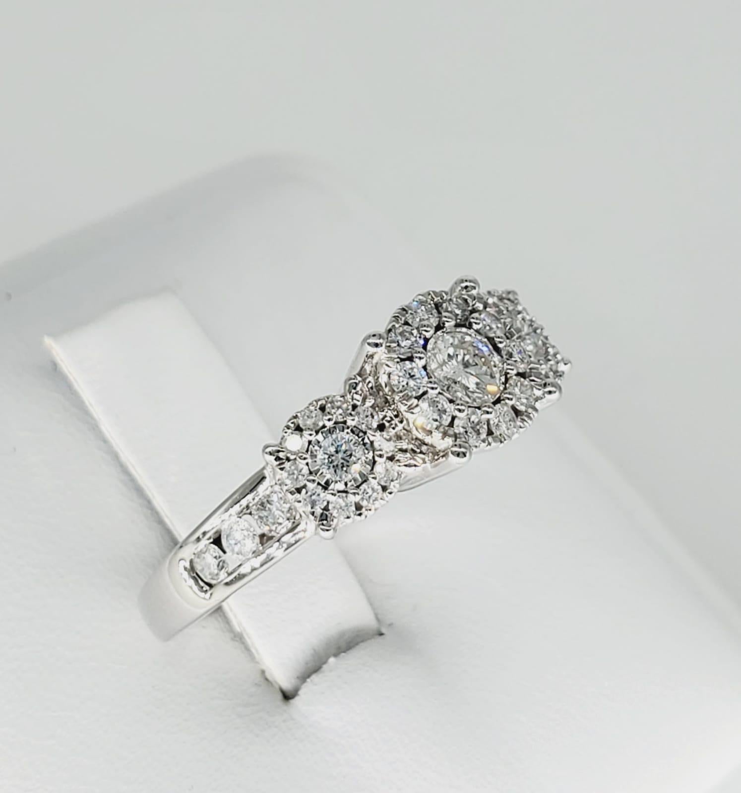 Unique Diamonds 1.50 Carat Engagement Ring 14k White Gold. Beautiful ring made by designer UD (Unique Diamonds) featuring many diamonds totaling approx 1.50 carats. The ring weights 4.8 grams and is a size 6.75