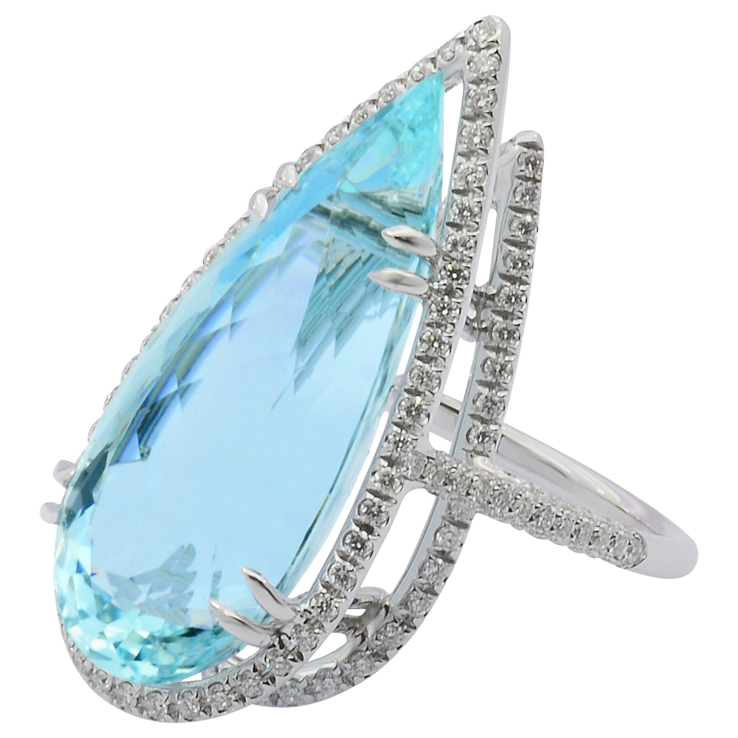 Handcrafted in Margherita Burgener workshop based  in Valenza, Italy, the enchanting ring is centering a Brazilian 22.27 carat aquamarine, drop cut, surrounded by a double line of diamonds.

18 KT white gold g 7.54
n. 178 diamond ct 1.04 quality of