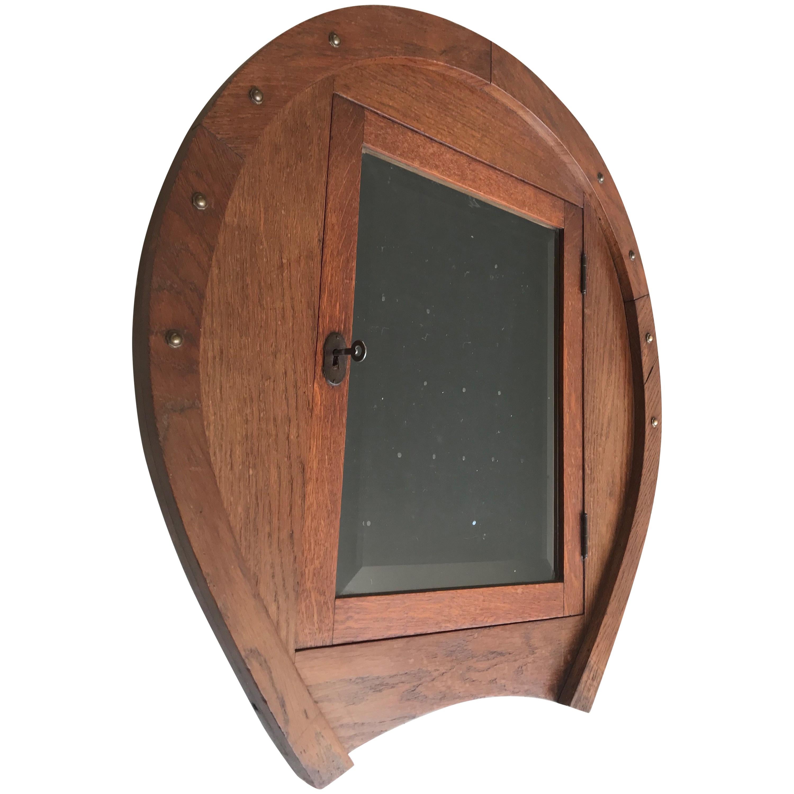 Unique Early 1900s Horse Shoe Shape Display Wall Cabinet with Beveled Glass Door For Sale