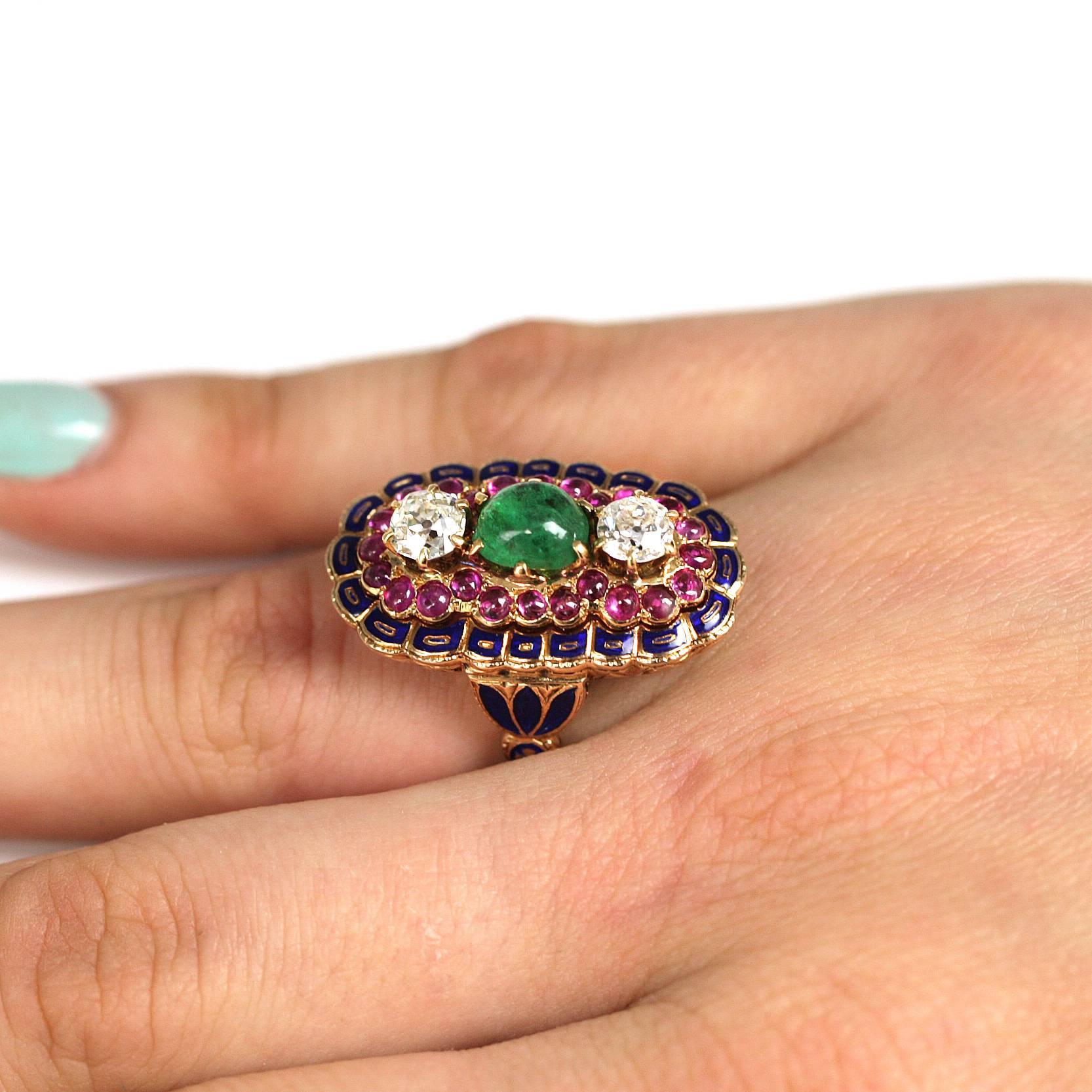 The 18 karat ring consist of  2 old mine diamonds weighing approximately 1.30 carats, J /K  in color and SI in clarity. The ruby and emerald have an approximate total weight of .75 carats. The is ring finished with with a fine  detailed blue enamel