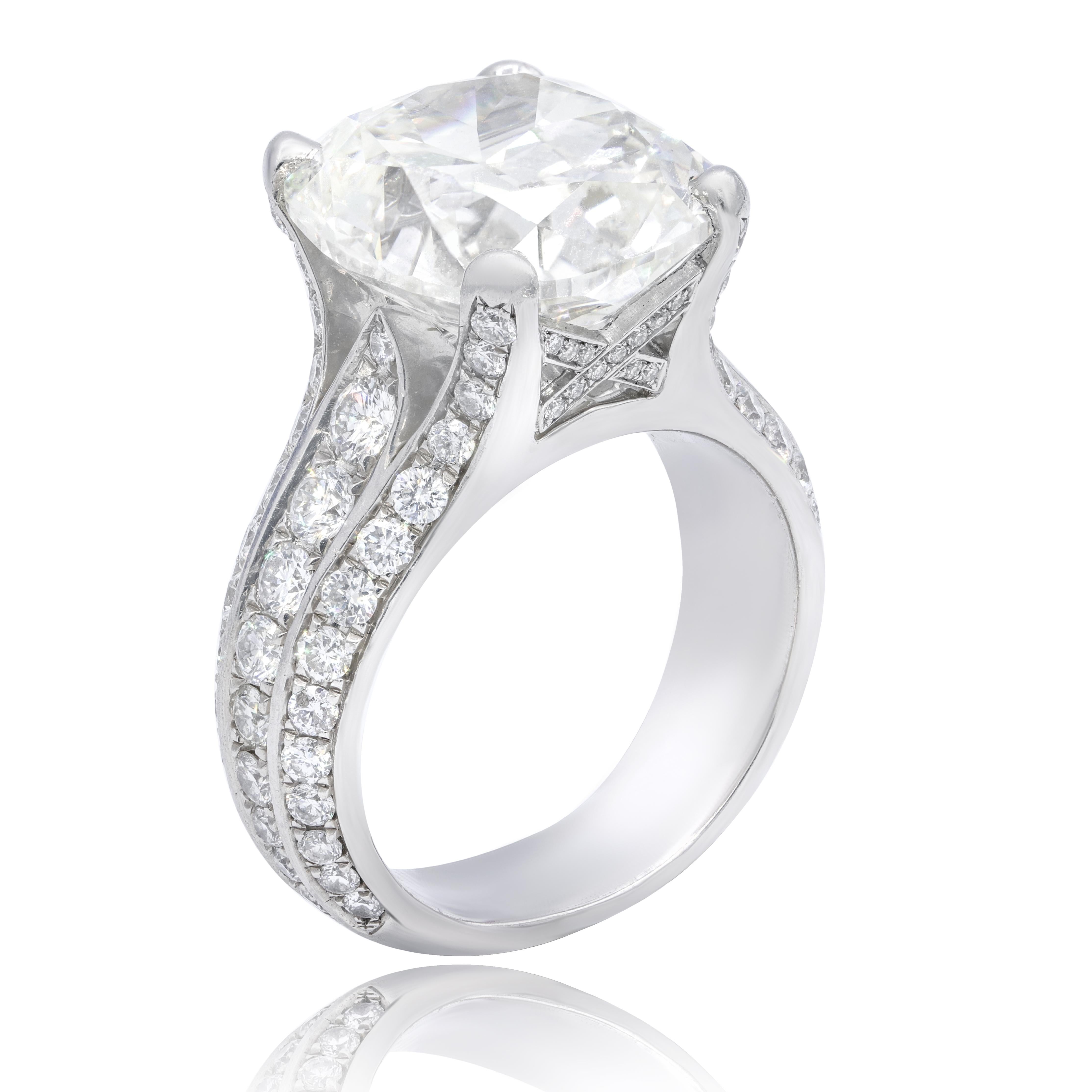 RADC521p/ this unique cushion diamond engagement ring showcases a magnificent 10.73-carat, GIA-certified (GIA 16394978) cushion cut diamond (k color; vs2 clarity) in the center and 2.50 ctw of dazzling round diamonds 
