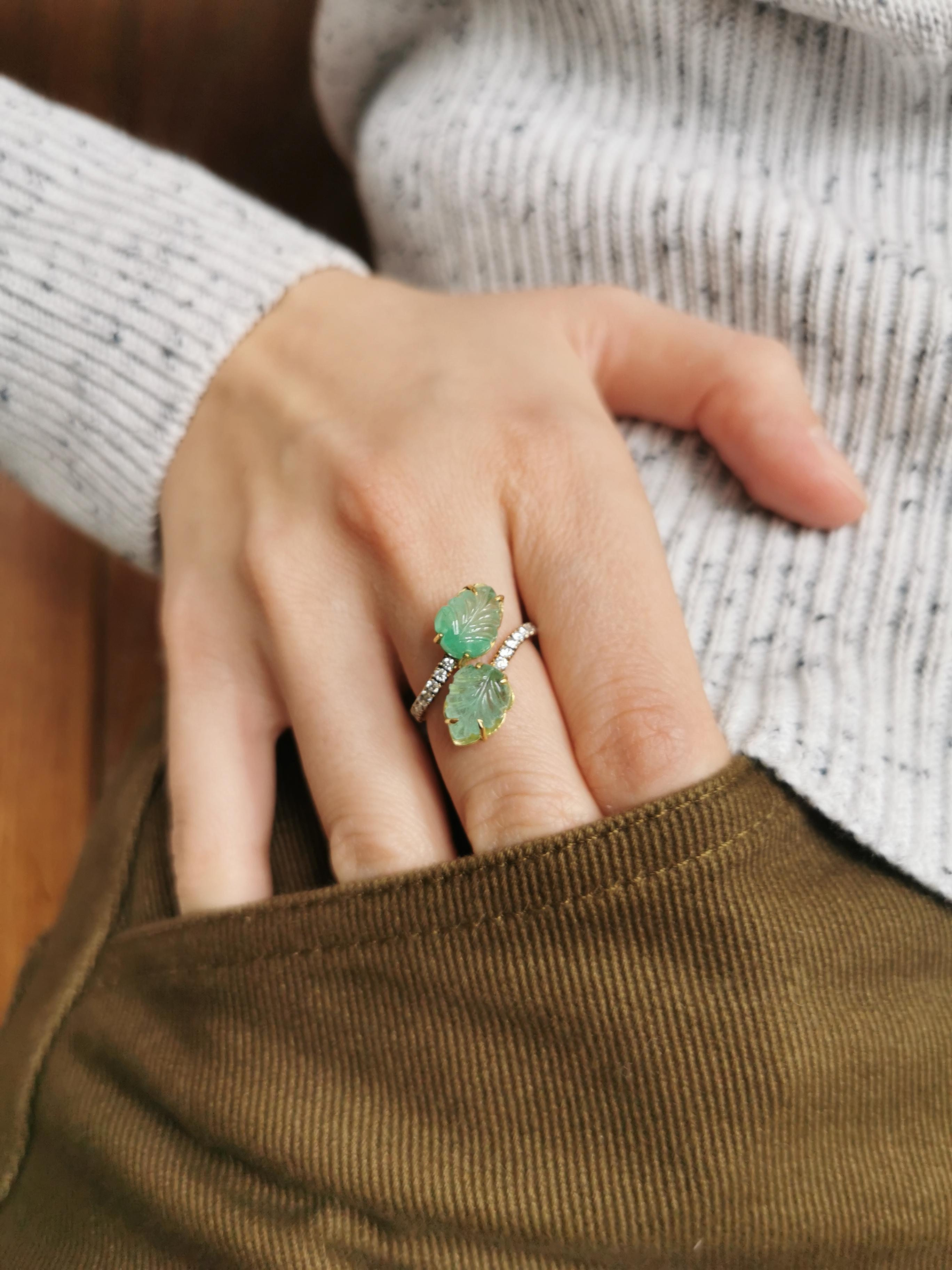 Made of 18K yellow and white gold, this charming and delicate You and Me ring is setted with two engraved emeralds, stylised leaves with sixteen  white diamonds on the mount.
Engraved emerald weight: 4.00carats
Round diamonds: 0.20carats
Size