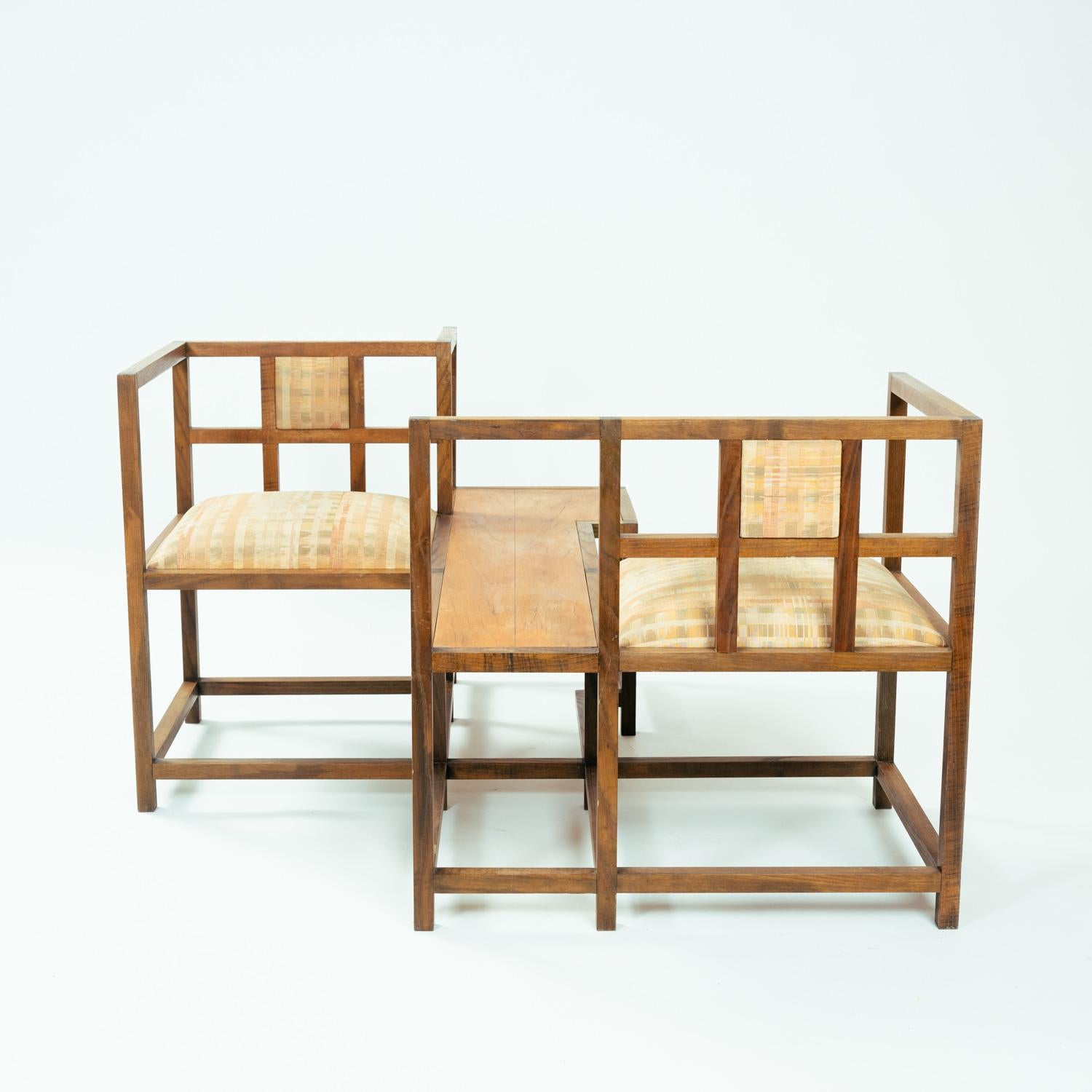 This unique and one of a kind Face to face or vis-a-vis seating arrangement in pearwood is designed by Menno Wieringa, who designed and built unique furniture in the 1970s -1990s under his own management and in his own workshop.
This design was