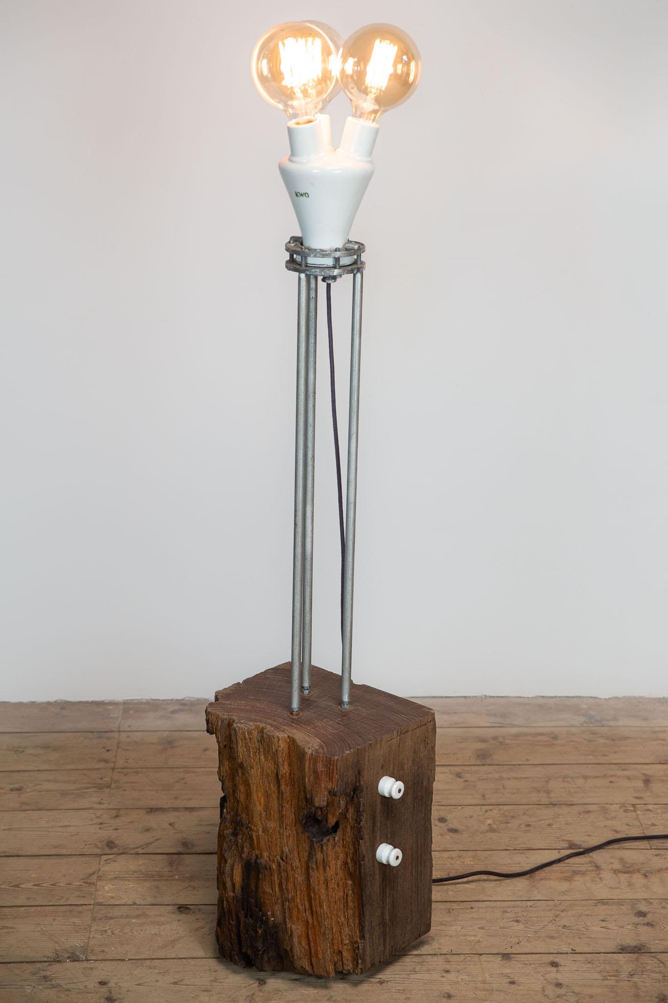 Unique Floor Lamp – A Piece of History and Design

This unique floor lamp is a one-of-a-kind design object crafted from an Azobé wood post that once stood in the canals of Amsterdam. The richly weathered wood carries the marks and stories of decades