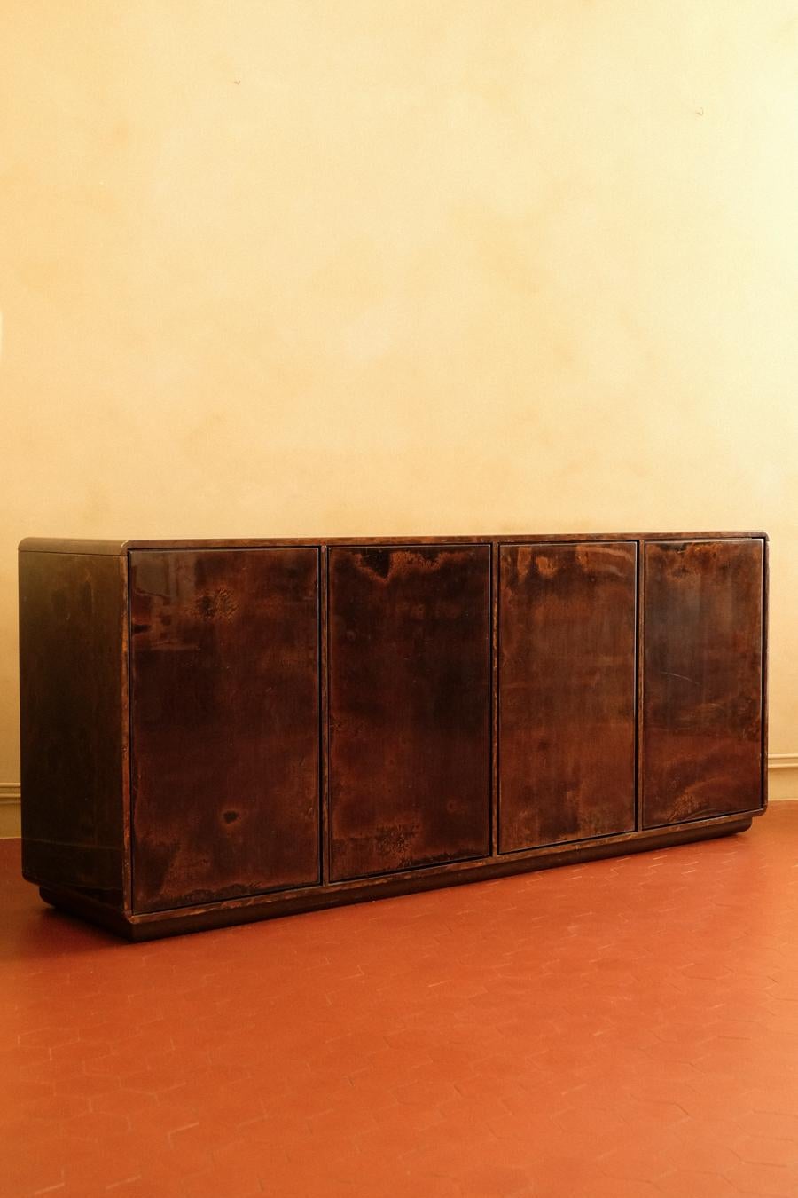Very rare sideboard designed and made by the small Italian firm Ottini Milano, circa 1970. Made from wood entirely covered in lacquered parchment. Ottini was renowned among Italian designers and architects for making furniture using only