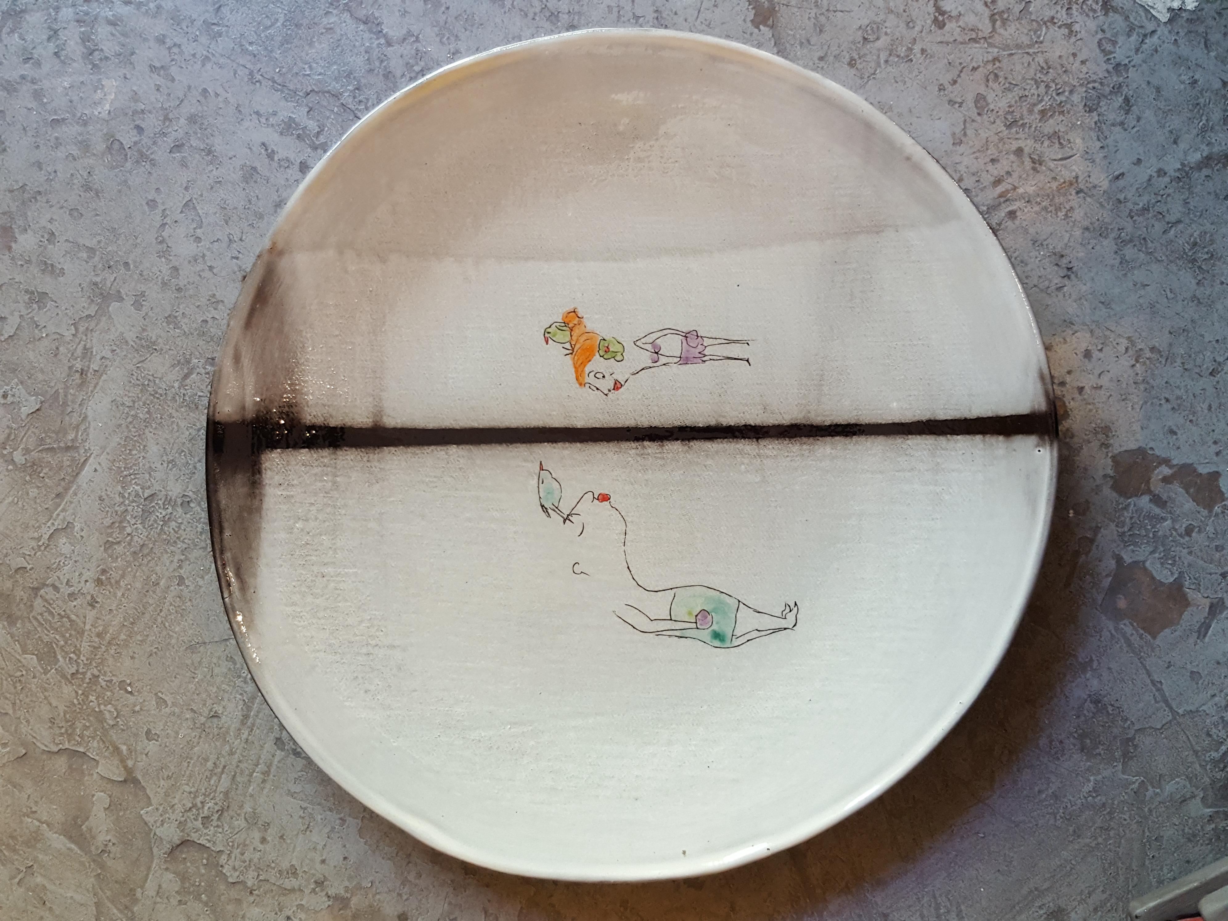 Ceramic earthenware faience dinner soup plate artist creation, all handmade in France. Or beautifully as wall decoration as well.
Using plaques of dark faience, graffiti, paint and enamel.
Decoration hand painted with the artist's creative poetic