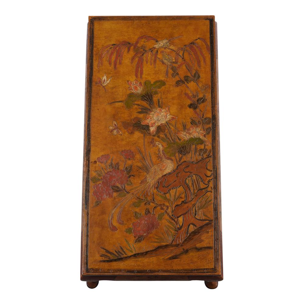 This French Chinoiserie style coffee table with beautiful details depicts blossoming plant life and a pheasant seating on a branch, carved legs along with displaying a wonderful cracked texture finish.