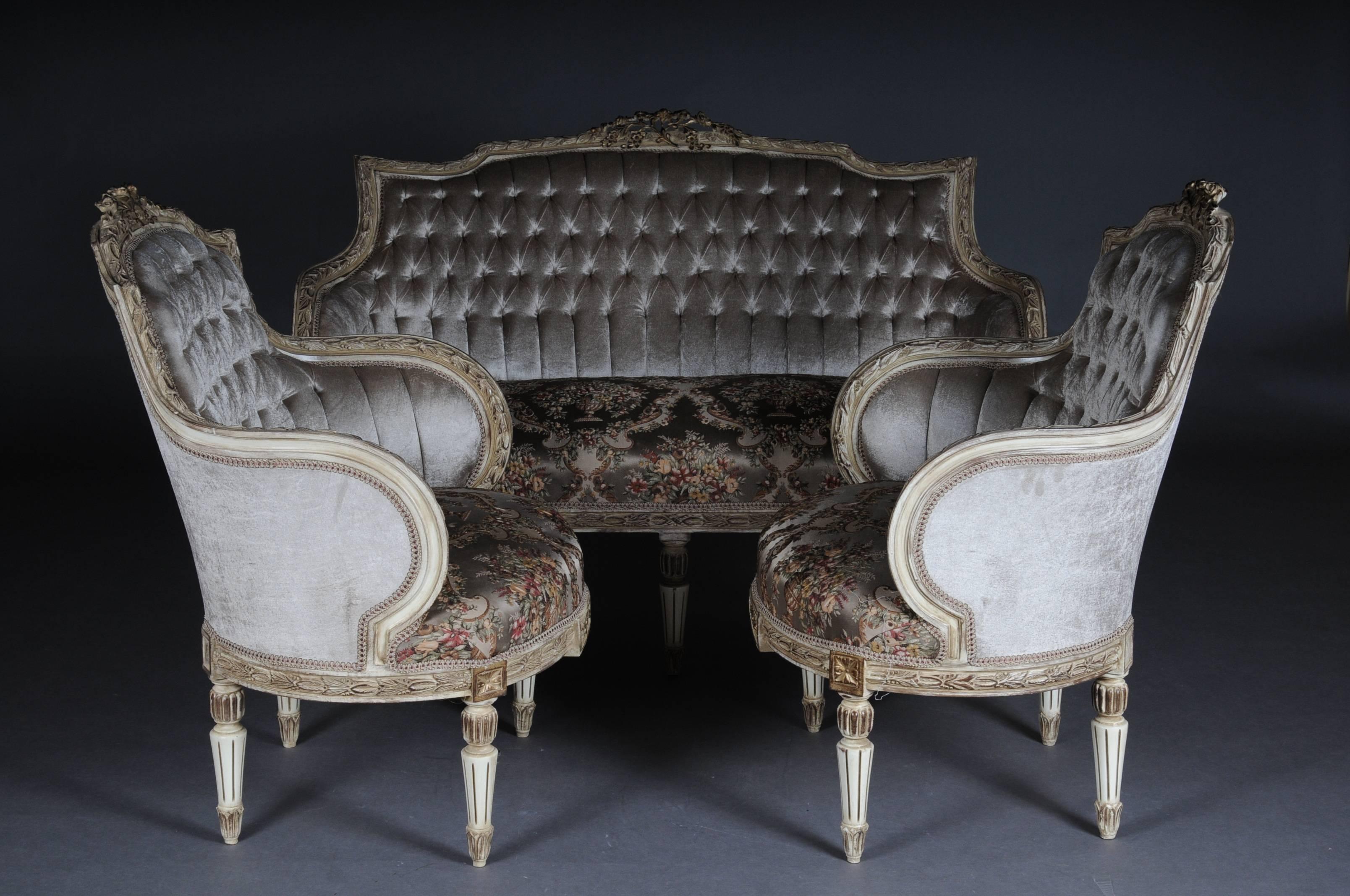 Solid beechwood, carved and partly gold-plated. Semicircular rising backrest framing with rocaille crowning. Profiled frame with richly decorated carving. Profiled frame on conical, fluted legs. Seat and backrest are finished with a historical,