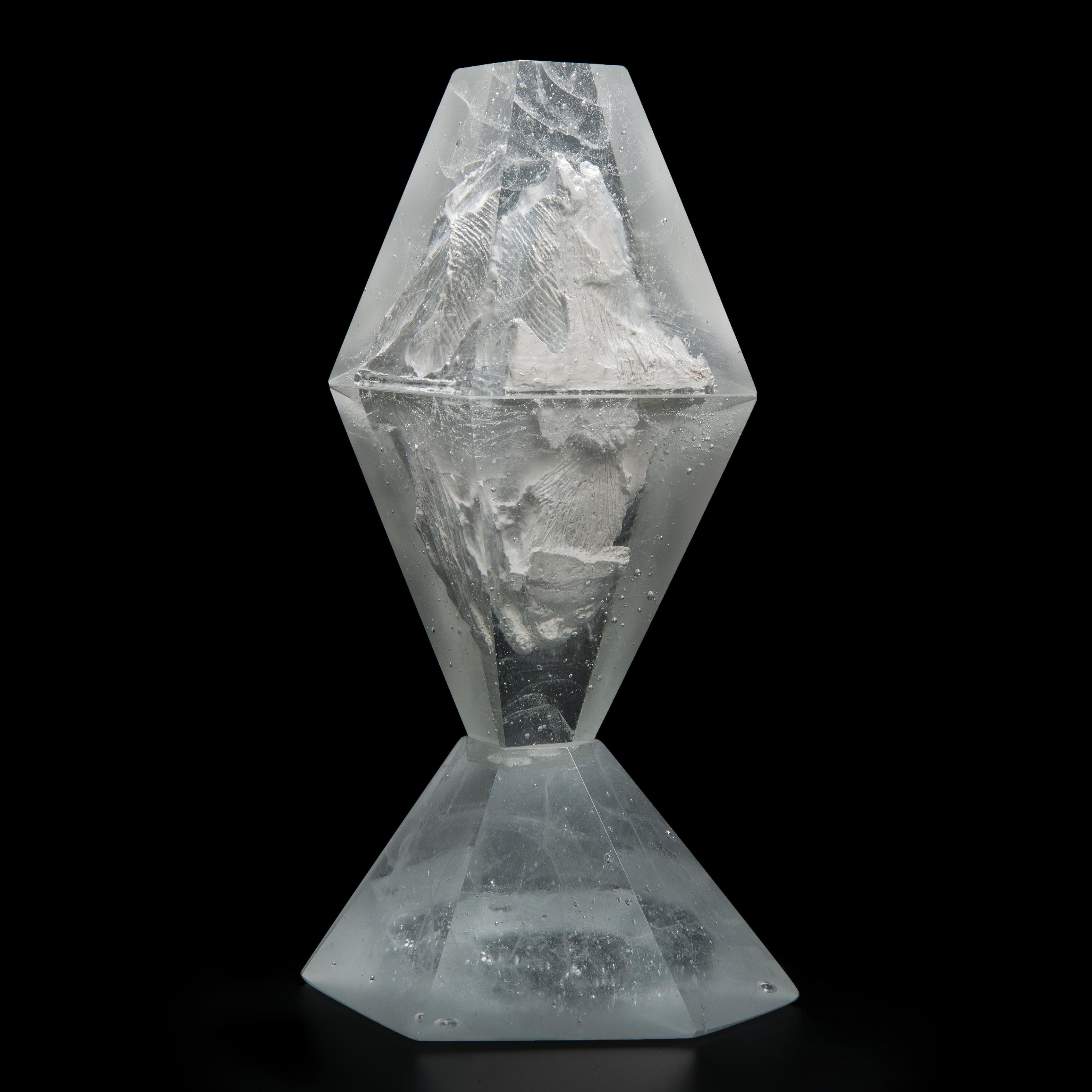 Unique Frost, is a clear cast glass sculpture by the Norwegian artist Lene Tangen. Captured in the centre of this piece, suggestive of an iceberg, is an inner core of plaster. The glass surrounding this creates a magical, glistening effect against