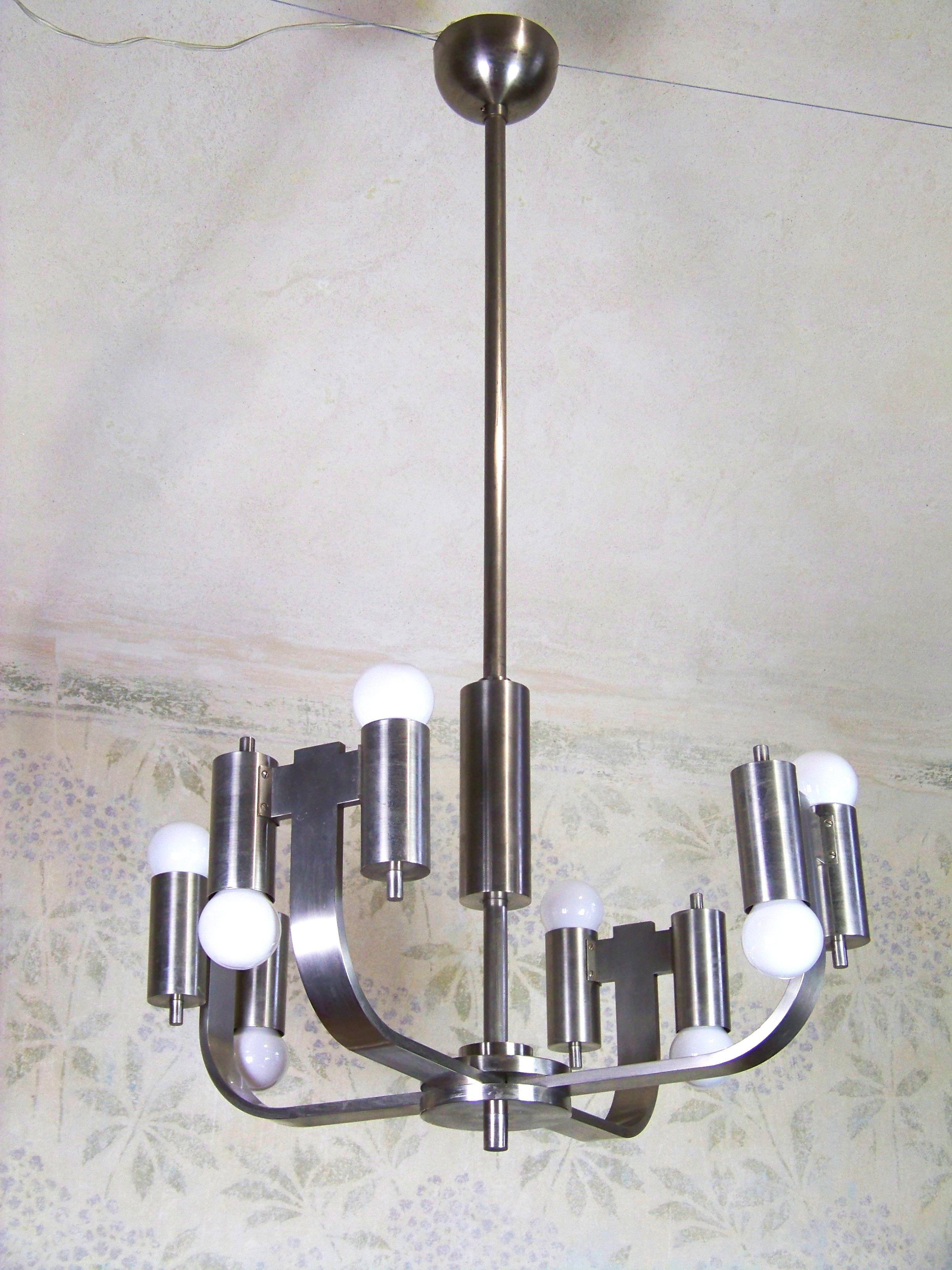 The chandelier is made of brass nickel-plated construction. The chandelier has two circuit that can be used separately (One lower, the other upper).

Fully functional in perfect original condition. New cabling.