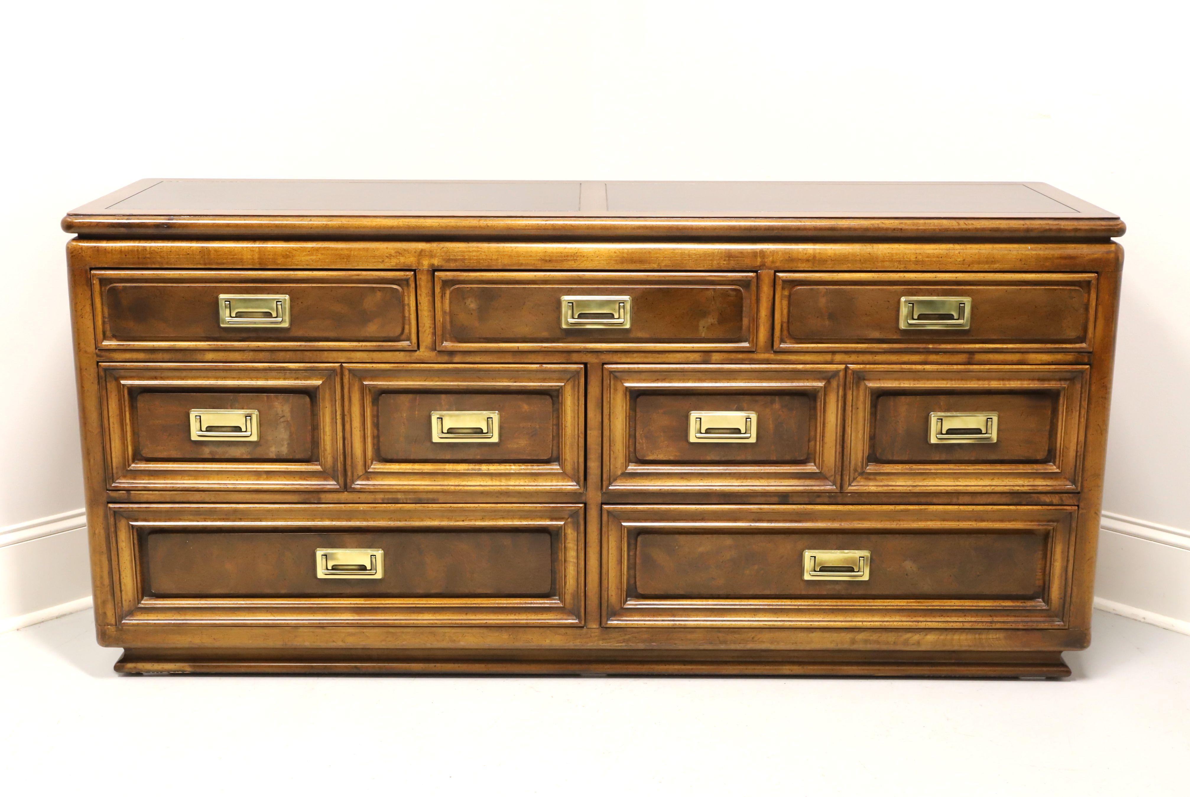 An Asian style triple dresser by Unique Furniture. Nutwood with slightly distressed finish, burlwood to top & drawer fronts, banded top and brass hardware. Features three smaller over four larger drawers of dovetail construction. Made in