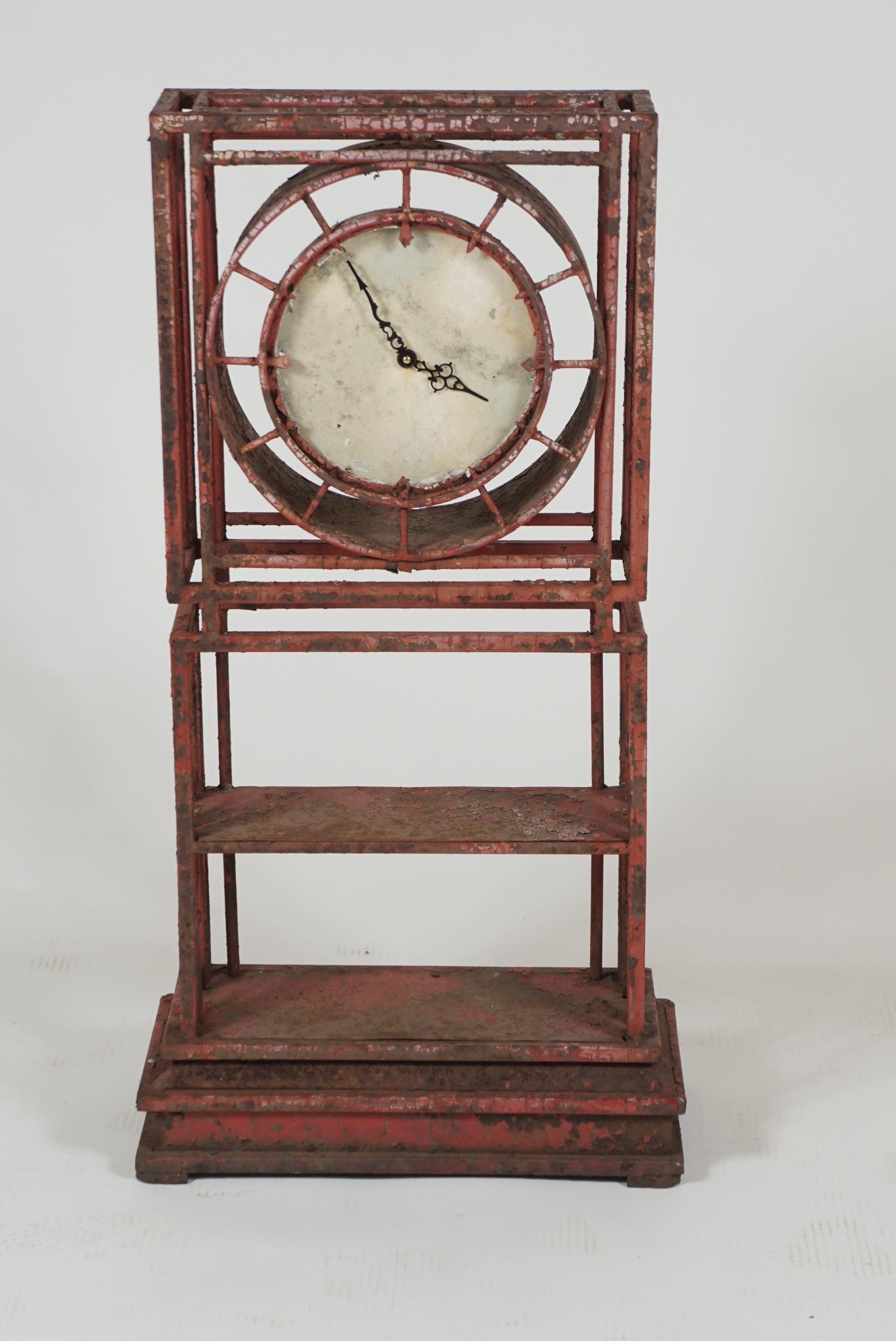 This clock constructed in iron and painted red. A sturdy form for outside in the garden. (The timepiece has been converted to battery operation)
A lovely form with great lines. Useful for keeping time inside or outside.