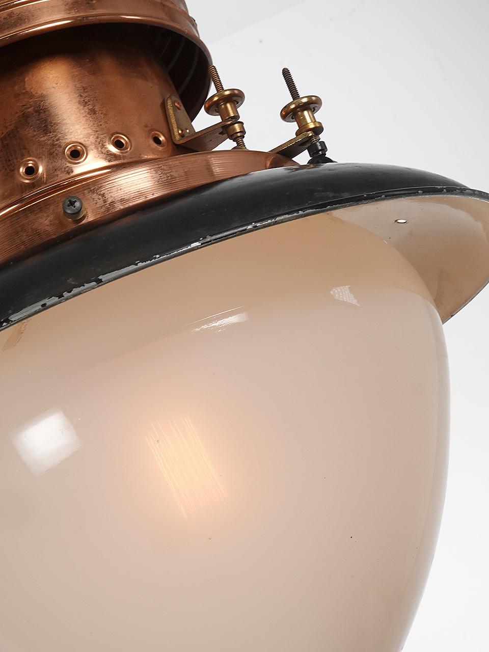 I like the wide compressed look of this early lamp. The impressive acorn globe has a clam broth finish that softens the light and gives a warm glow.
