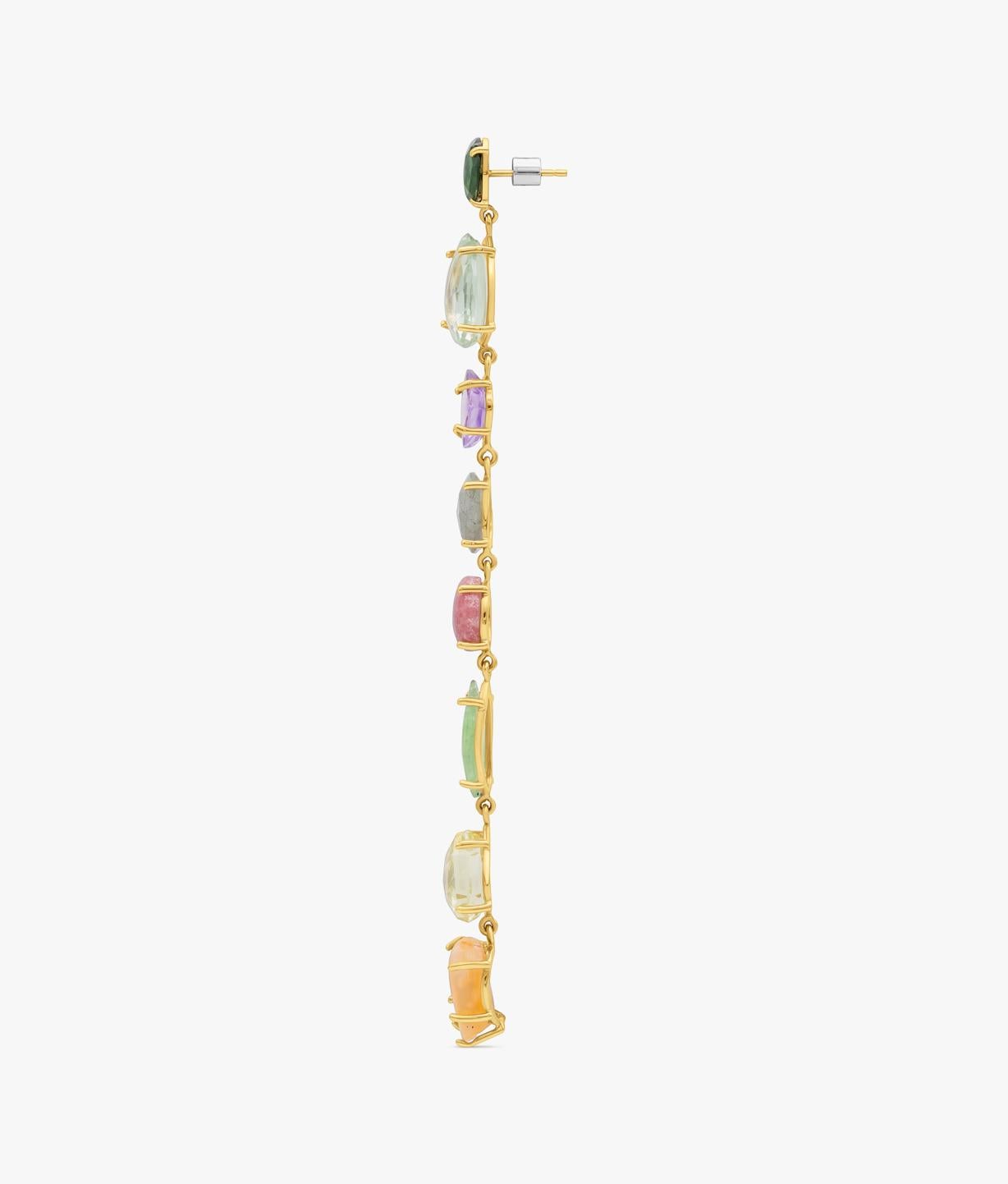 One-of-a-kind broken gems single earring. Hand-made assembled on a 14-karat gold frame, this long earring is a statement piece composed by a cascade of eight gemstones: two quartz, one fluorite, one cornelian, one peridote, one amethyst, one chrome