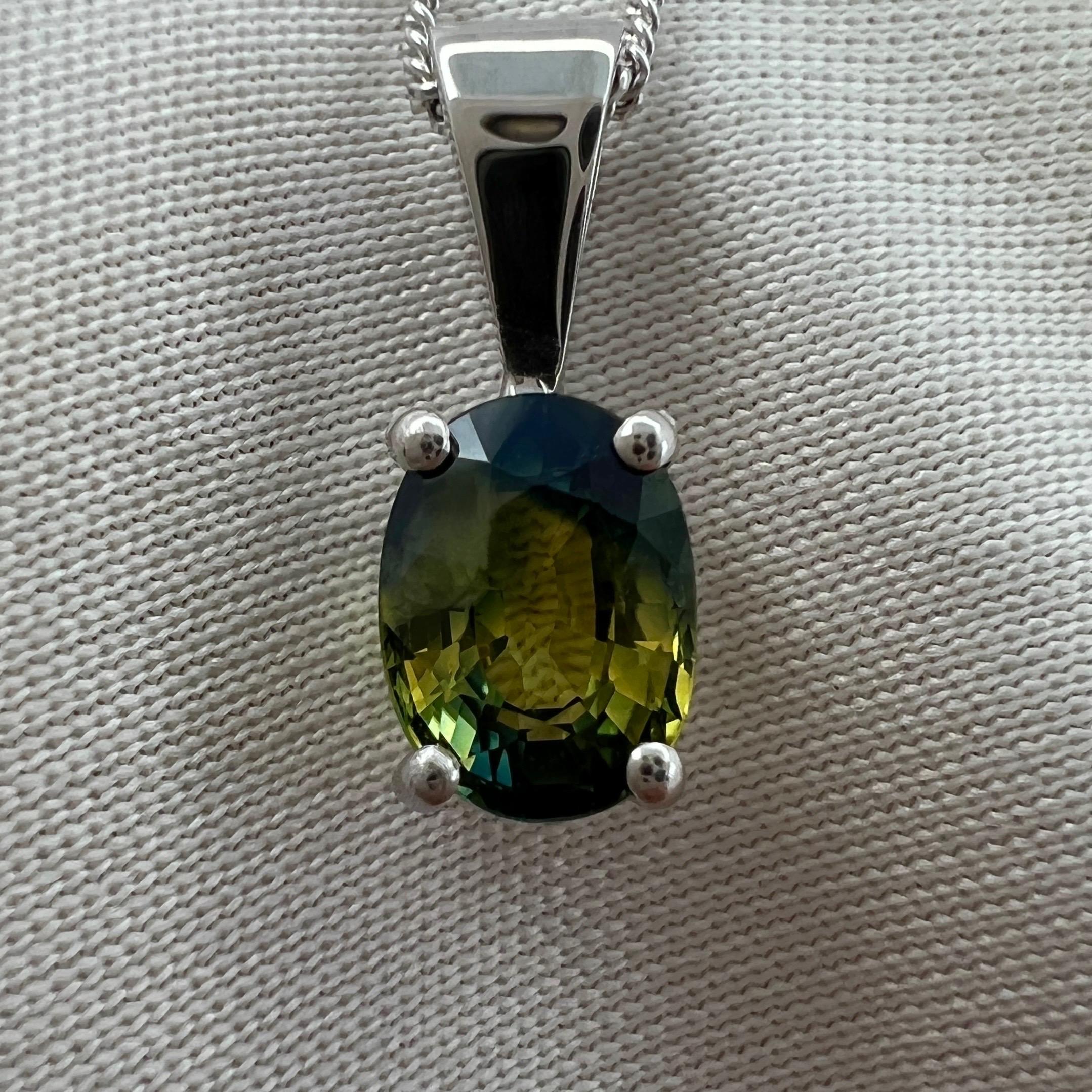 Natural GIA Certified Untreated Parti Colour Australian Sapphire 18k White Gold Pendant Necklace.

1.09 Carat oval cut sapphire with a stunning parti colour effect. Unique blue, yellow and green colour zoning. Stunning gem.

Also has good clarity