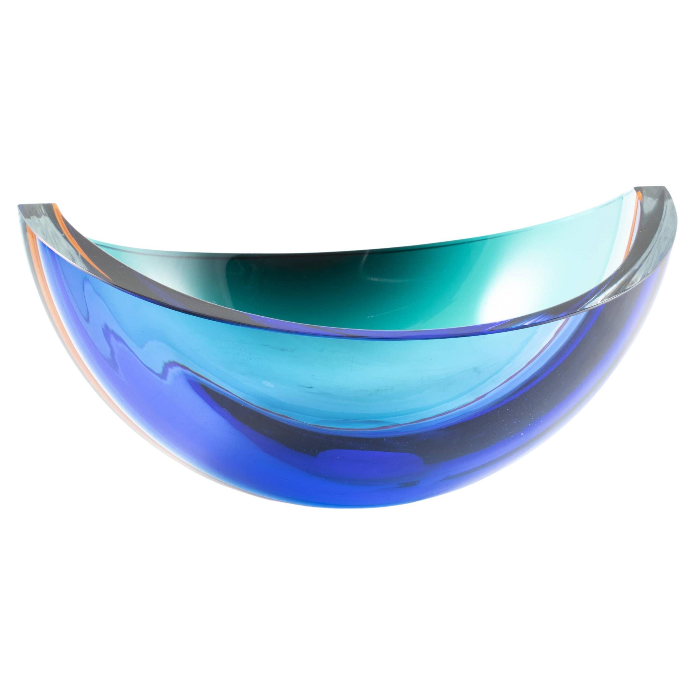 Sidse Werner 1931-1989.
Rare and one-of-a-kind glass bowl. One half is blue the other is green, divided in the middle by an orange line.
Holmegaard approx. 1970.
Sidse Werner started working with the design of furniture, textiles, lamps and glass