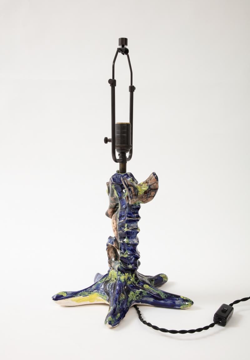 Unique Glazed Ceramic Table Lamp in the Shape of a Seahorse, France, 20th Century

Unique table lamp in the shape of a seahorse perched on a starfish; nautical yet modern with expressive, colorful glaze. 

Newly re-wired with a black twisted silk