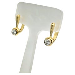 Used Unique gold diamond earings with safe continental lock
