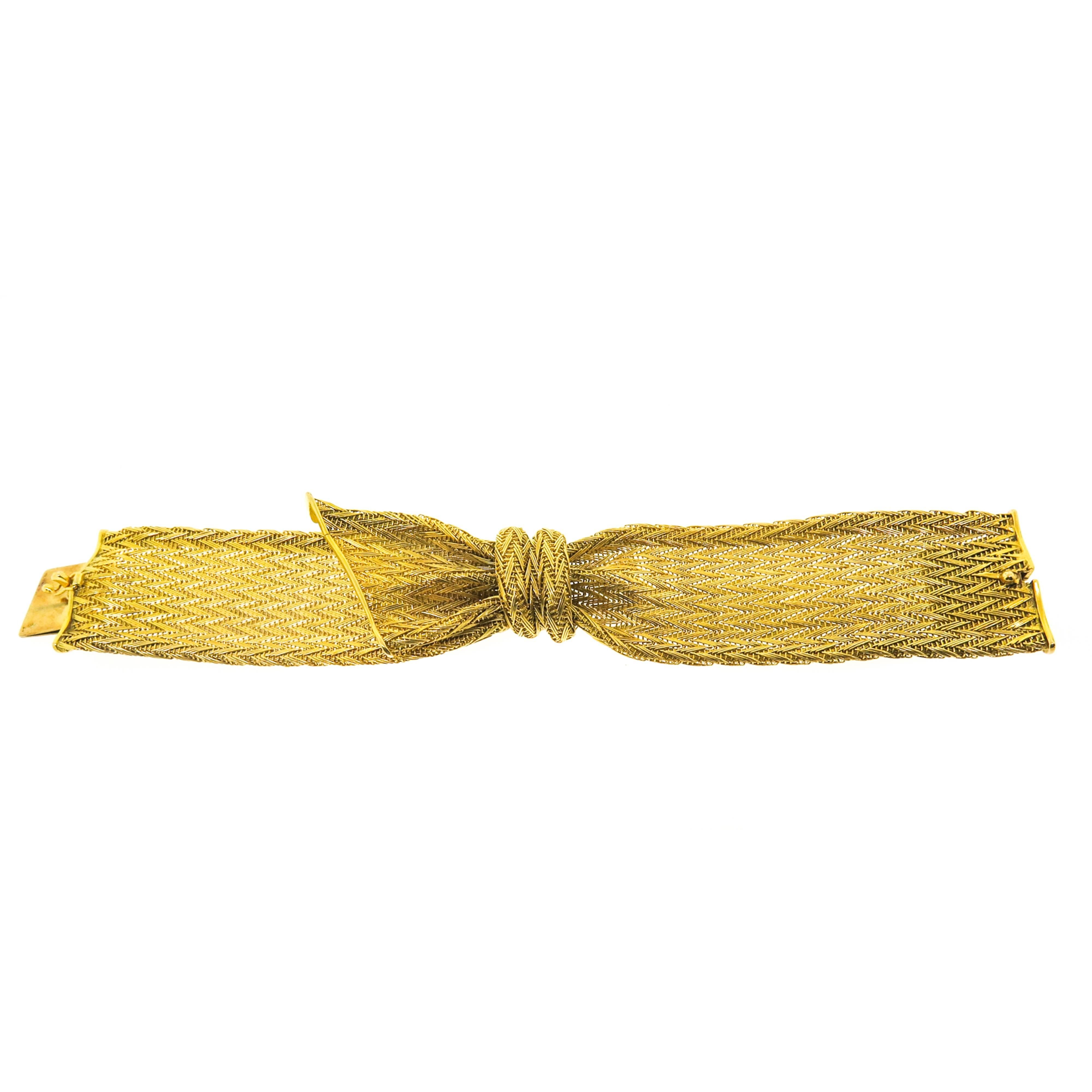 Circa 1960s, 18k Yellow Gold Mesh Bracelet, hand made in a Modern chevron design of textured meshed links. Secure clasp with safety. Measuring 1.2 inch wide and 6 1/2 inch in length. 
Just precious!!!