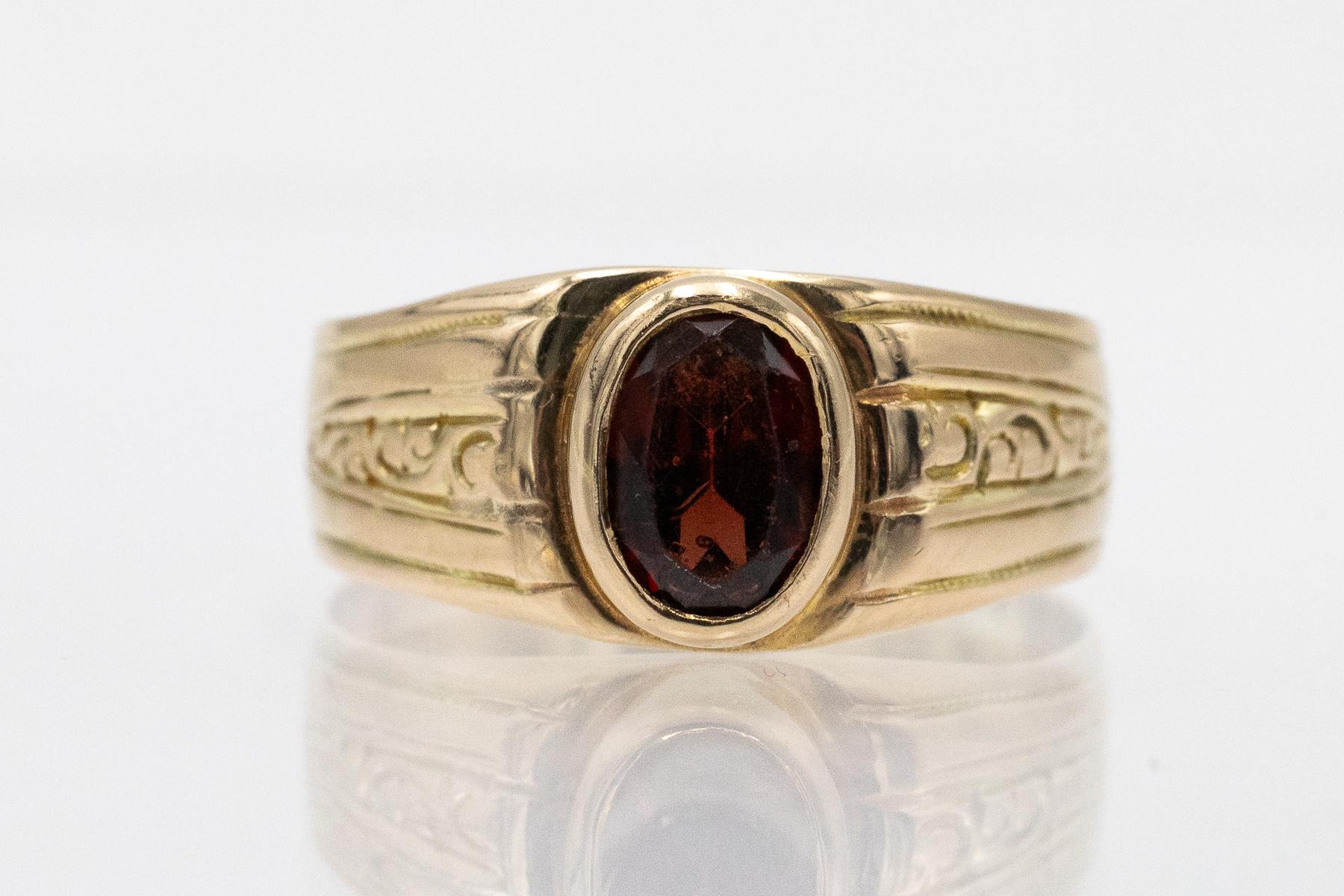 Women's Unique gold ring with a garnet, Austria, turn of the 19th/20th century. For Sale