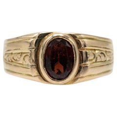 Unique gold ring with a garnet, Austria, turn of the 19th/20th century.