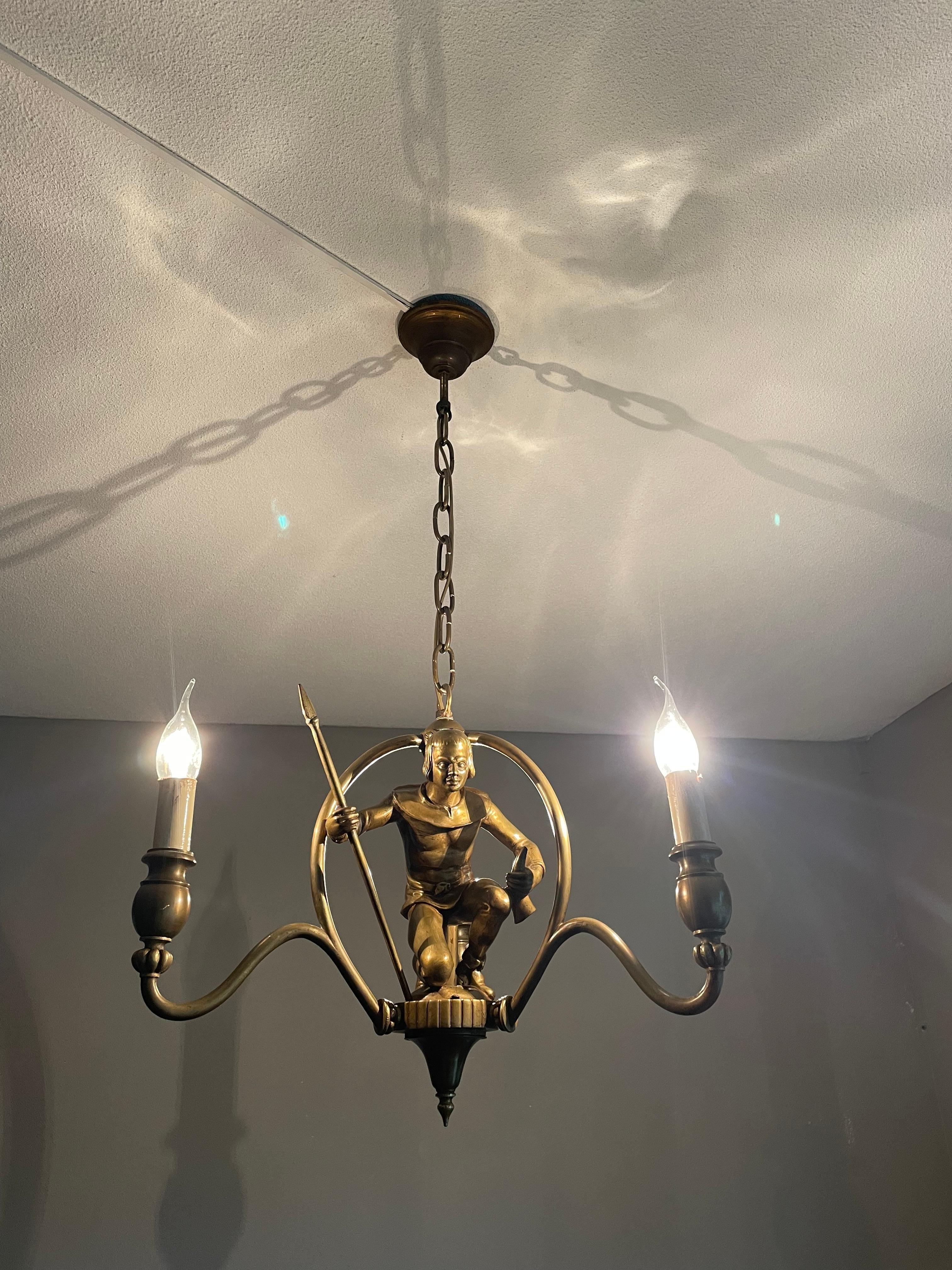 Stylish and highly decorative three-light Medieval Style fixture.

With early 20th century lighting as one of our specialities, we have seen a lot of great and unique fixtures, but never did we come across a handcrafted, Gothic Revival pendant with