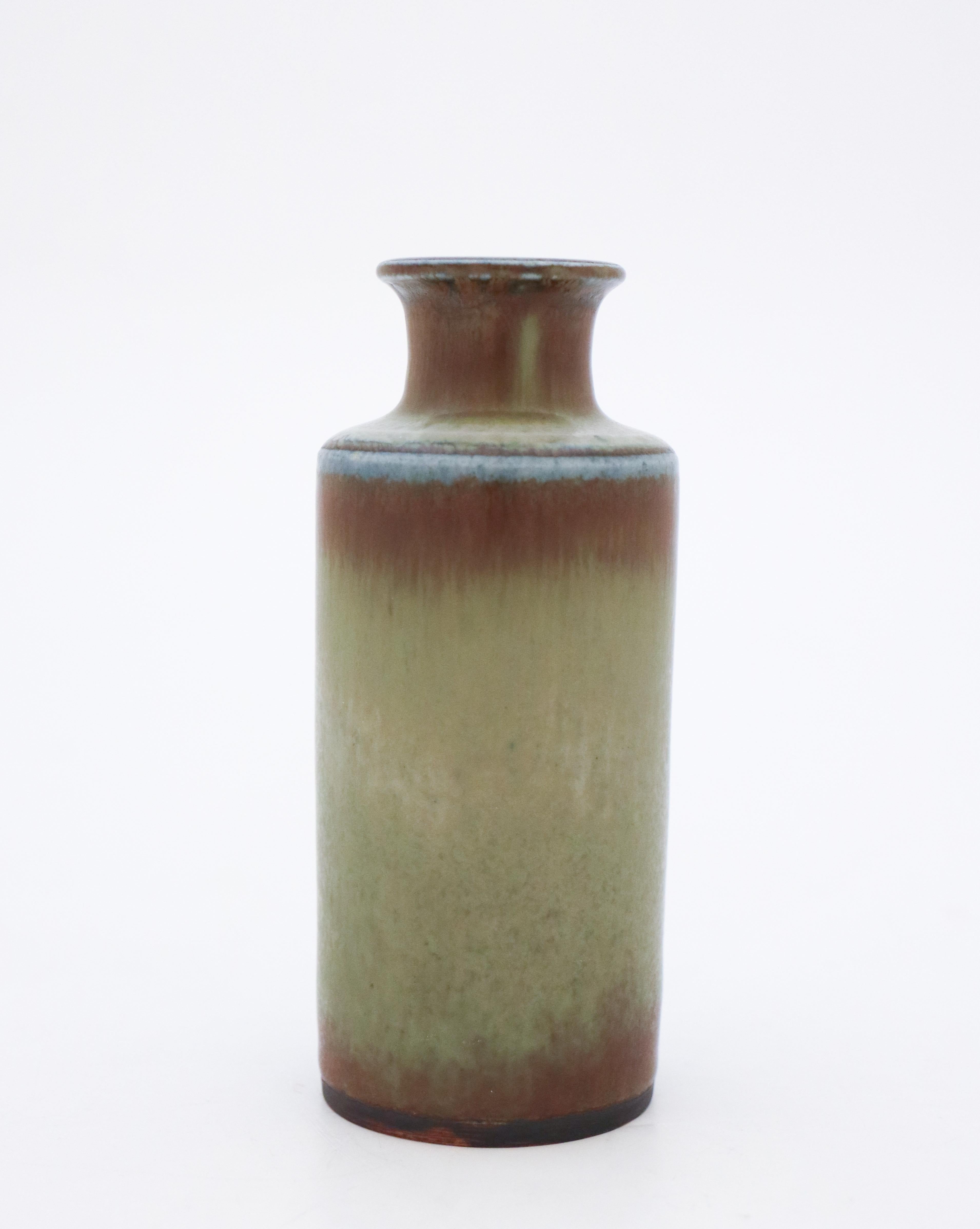 A lovely Midcentury Swedish vase in ceramics designed by Carl-Harry Stålhane at Rörstrand. The vase has a lovely green glaze. The vase is 12.5 cm high and in mint condition. This vase is unique and only made in this example as you can see on the