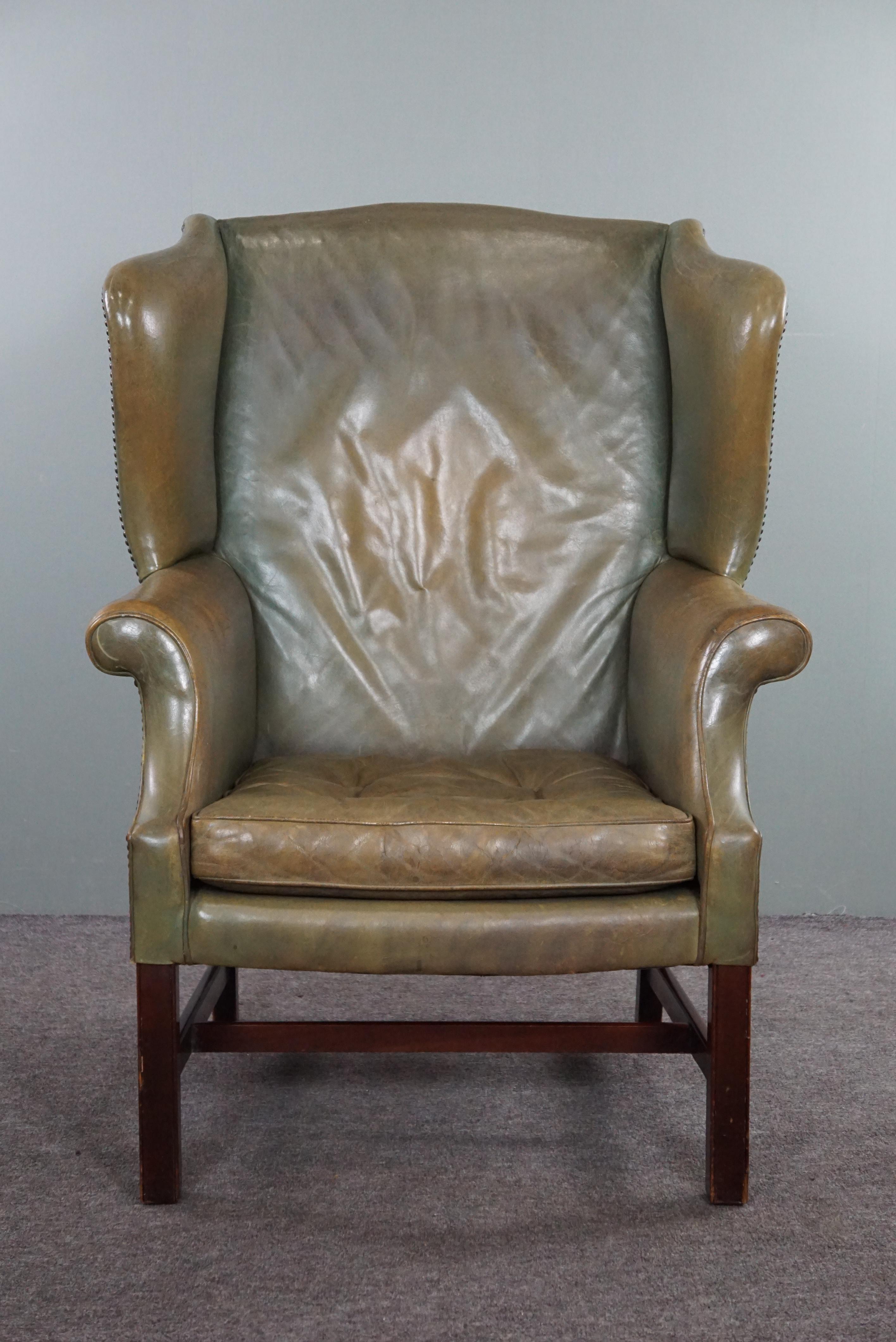 Offered is this green wing chair with character and comfort.

Do you have a corner in your home where this wing chair, with its beautiful green color, comes into its own? This armchair is perfect as a reading chair, or for relaxing while drinking a