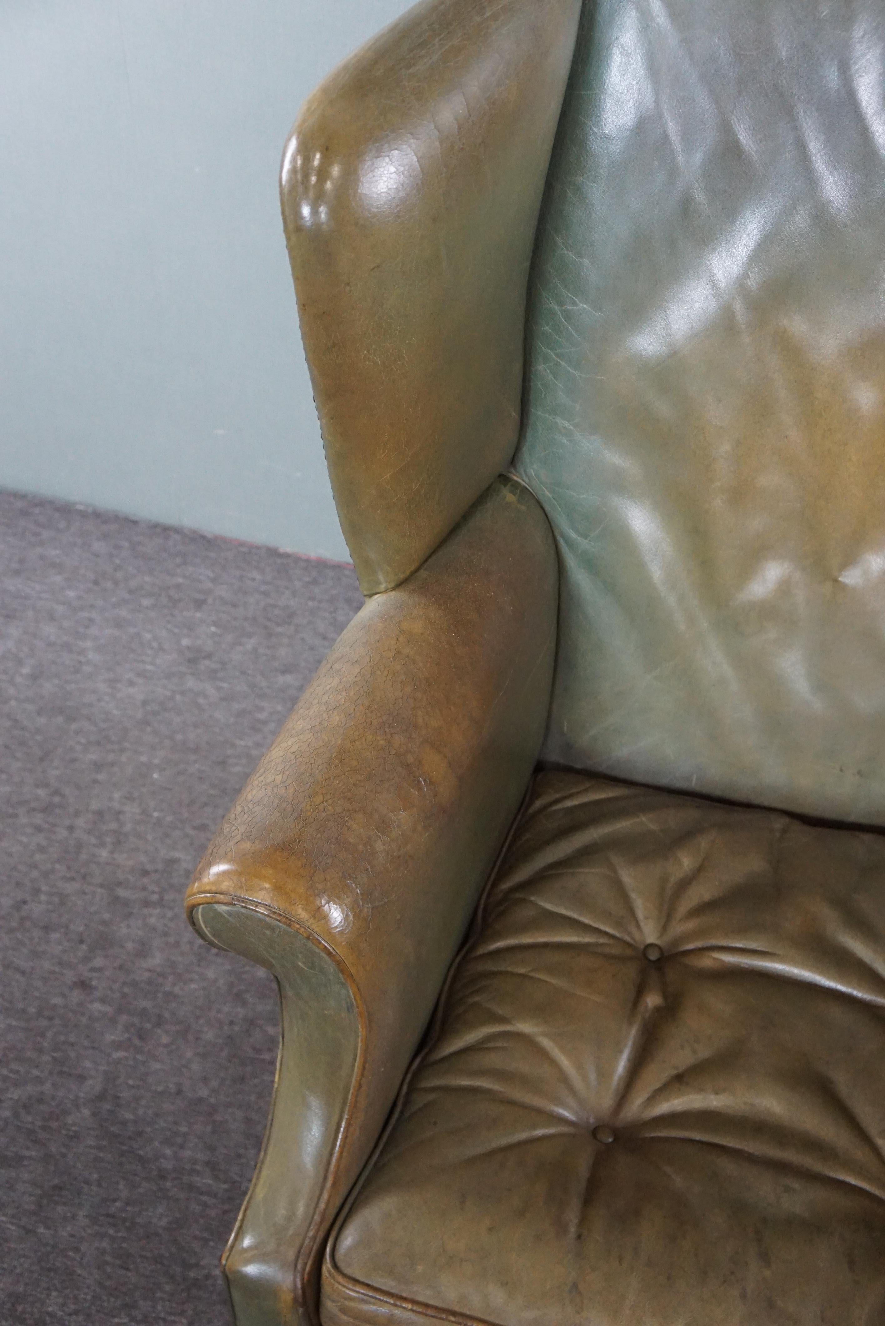 Unique green cowhide leather wing chair For Sale 1