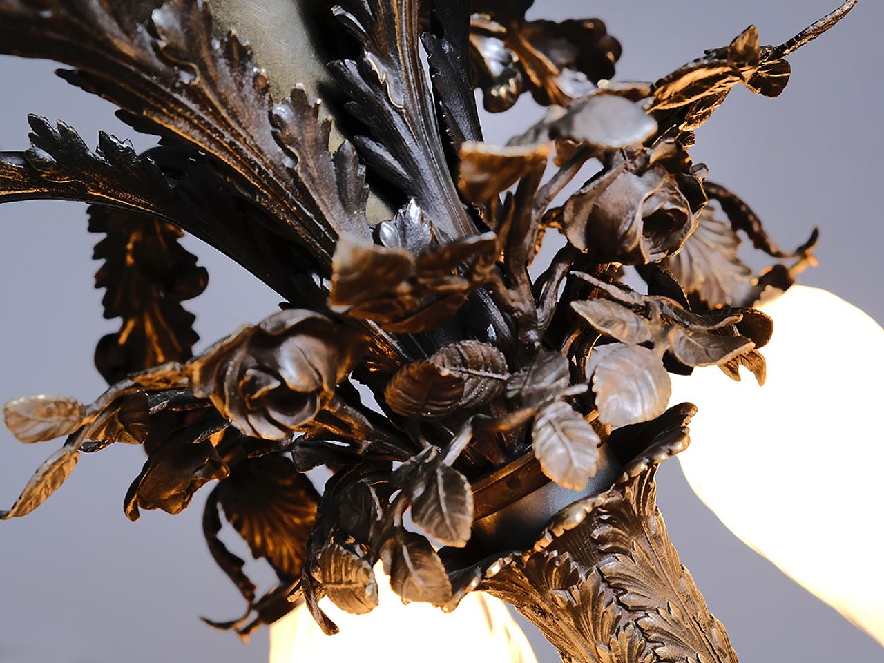 This Empire style lamp is unsigned but looks to be something important. Each shade is hand blown to have its own unique organic character and at the same time go together as a set. It's late 1800s but the glass has a Chihuly feel to it. This type of