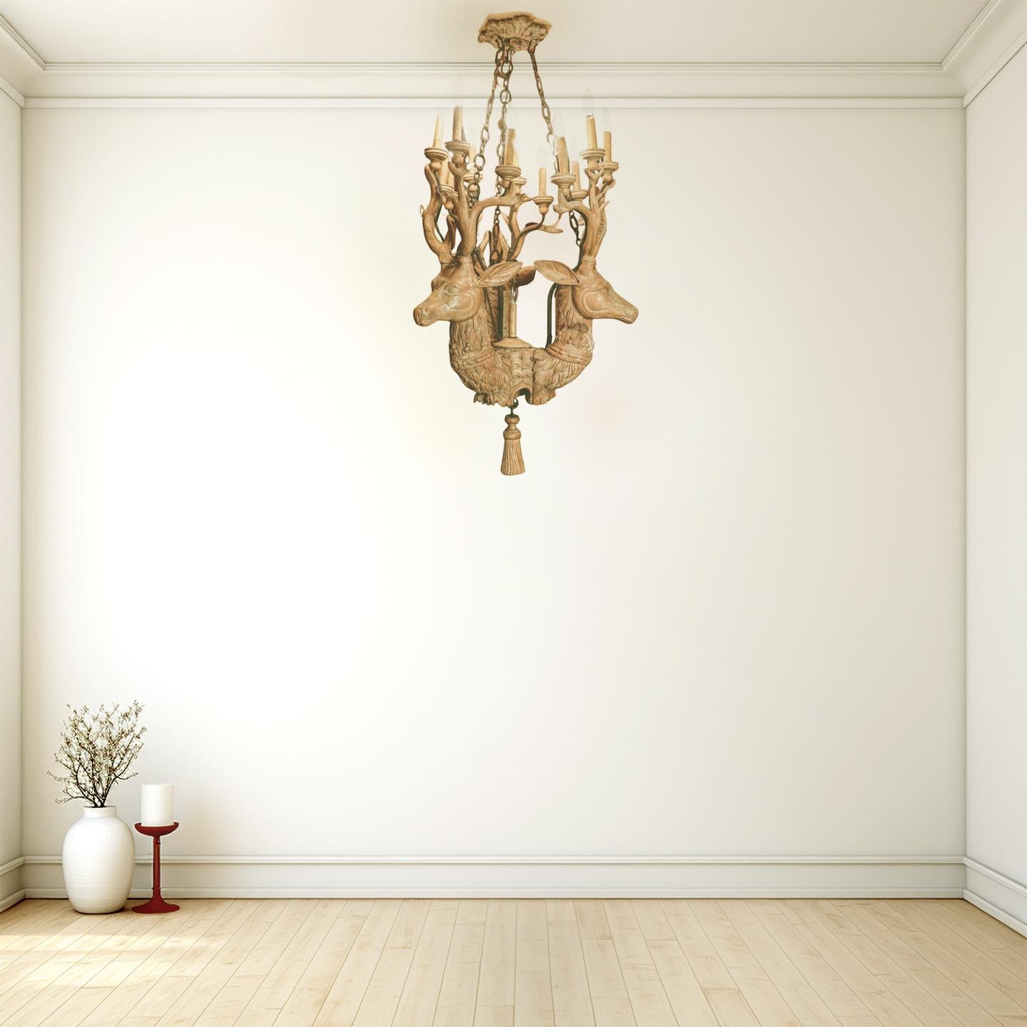 Anonymous
20th century; Sweden
Wood (possibly pinewood), iron

Approximate size: 54 (h) x 26 (w) x 26 (d) in.

This one-of-a-kind hand-carved and white washed wooden chandelier features a triad of intricately carved deer heads that elegantly emerge