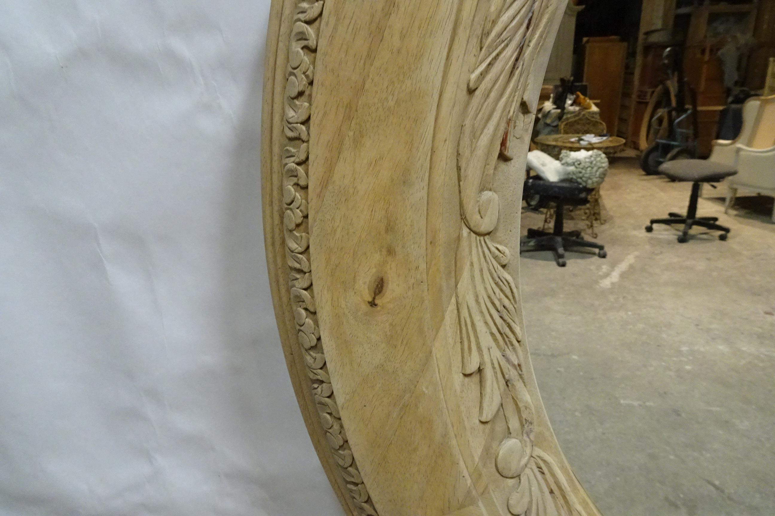 This is a Unique Hand Carved Round Wall Mirror. it had a dark brown stain on it so I stripped it to raw wood and left it that way.