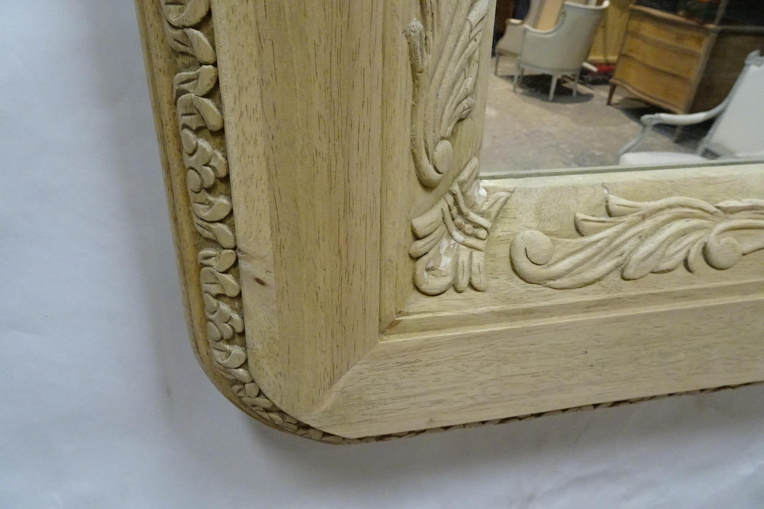 This is a Unique Hand Carved Wall Mirror. it was stained Dark brown and I stripped it down to raw wood and left it that way.