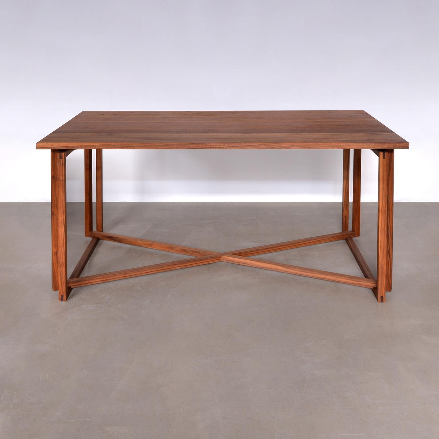 Unique hand crafted table in solid walnut wood designed by Laura Maasry and manufactured in Berlin, 2020.

Crafted by a master carpenter, the Fourframes-X is made is made with 100% high 
quality solid walnut wood for the tabletop and for the