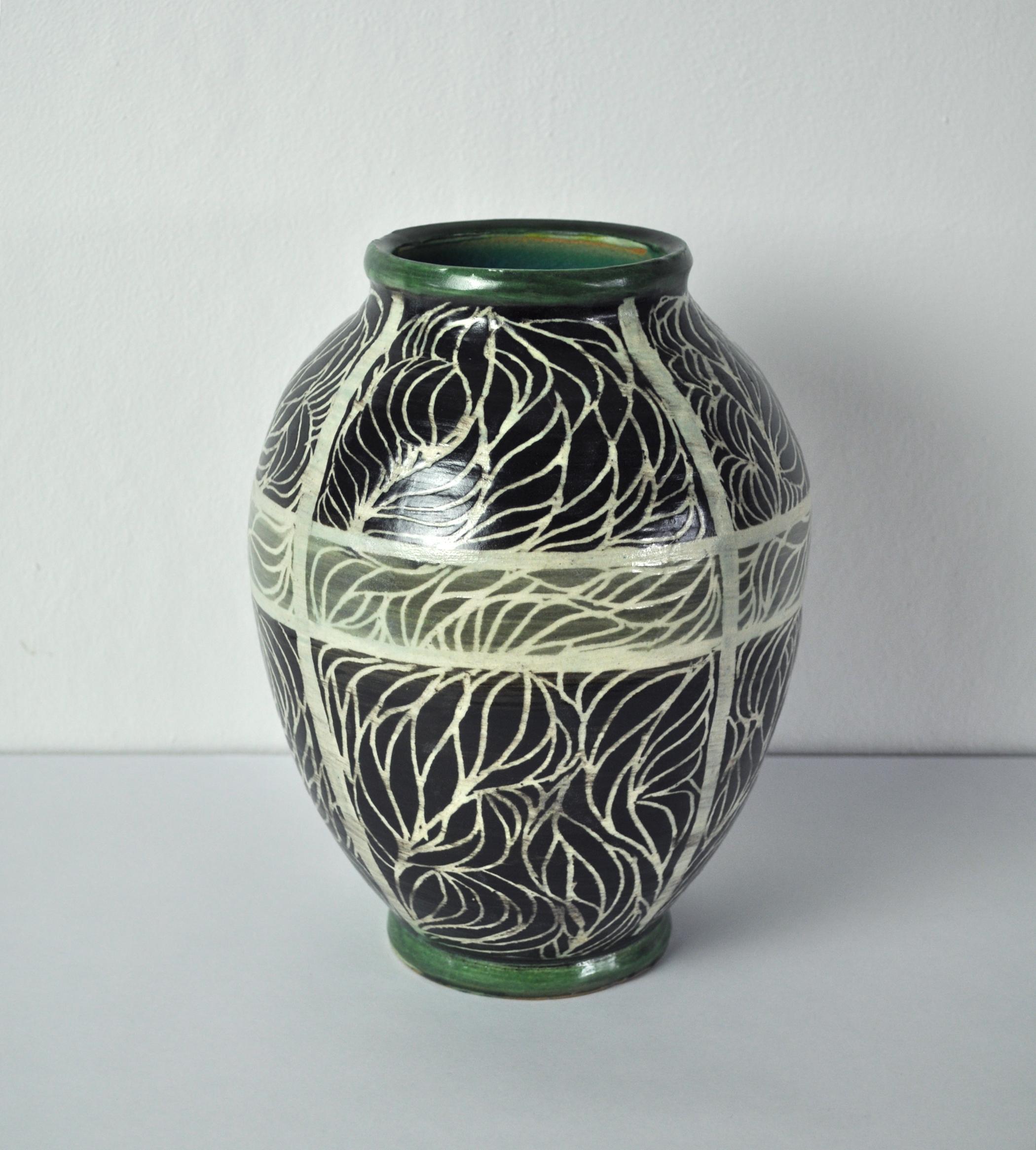 This vase is individually hand-thrown and hand-glazed, entirely unique. 
The artist, Jørgen Søe, is 2nd generation of a Danish family pottery workshop and continues the tradition of this special glaze.
Impressed artist's signature to