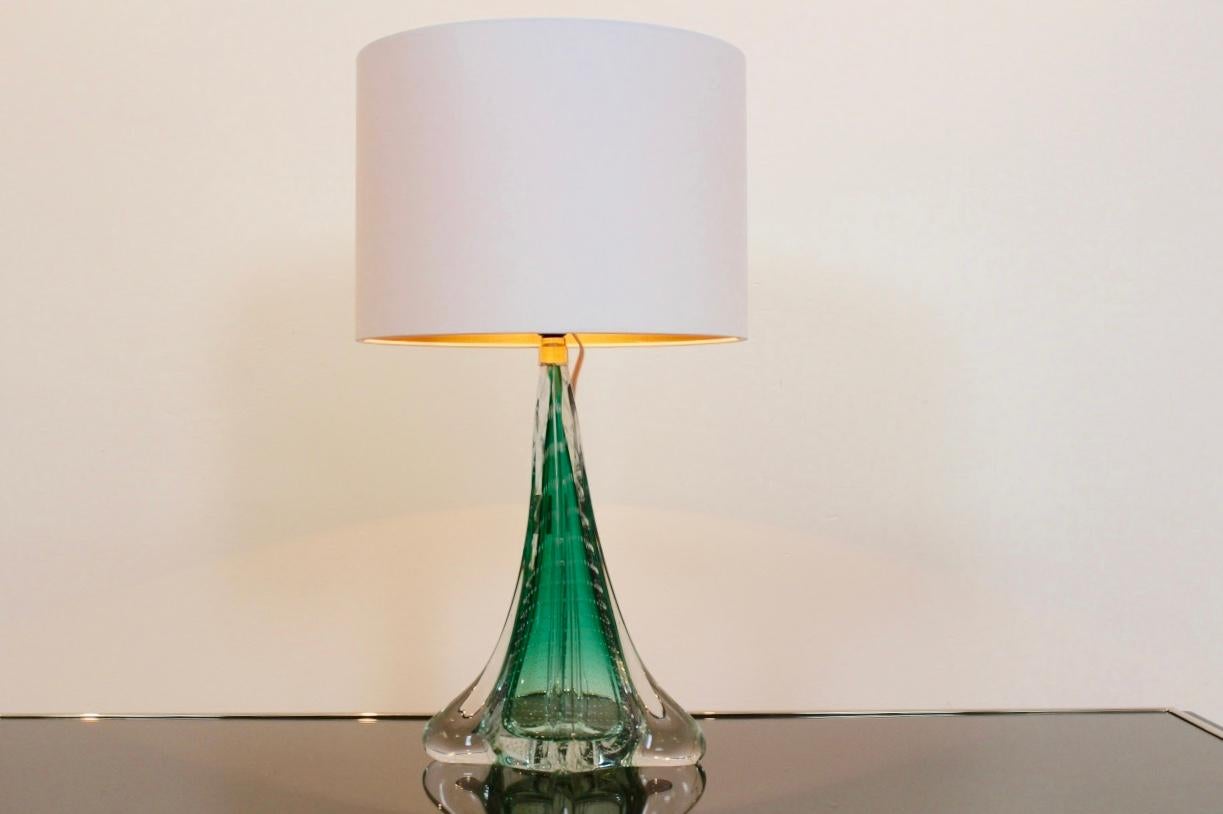 A unique translucent bubbled table lamp made by the old Belgium firm of Boussu in the 1960s. The history of glass production in Boussu is old and with great history. The factory has been closed for years now. This large scale hand blown glass lamp
