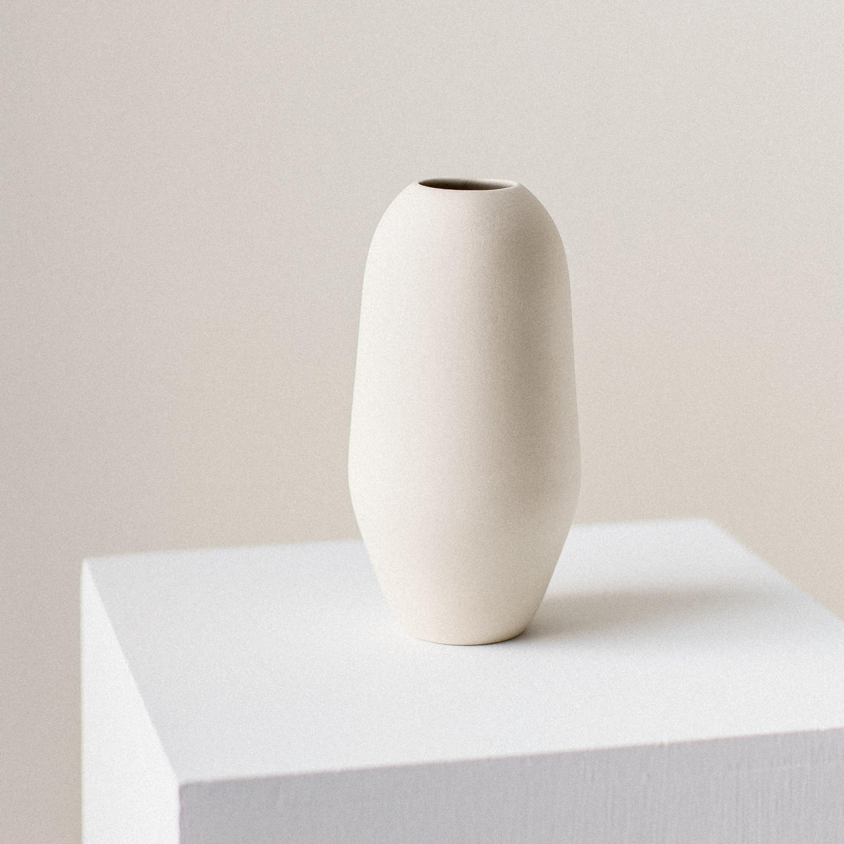 Unique heir vessel by Dust and Form
Dimensions: D 8.8 x 17 H cm
Materials: Porcelain

Origin Form Collection in three finishes: Hand-sanded (our classic, smooth, bare finish) Ivory (satin white glaze) Charcoal (matte black glaze). Please contact us.