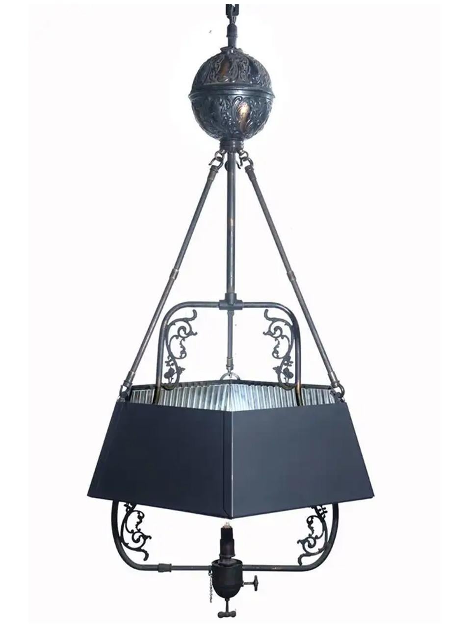 This is a very early fuel lamp. It dates before the use of piped gas and electric. It has been wired to take a standard base bulb but still retains the tank, valve, original finish and decorative details. There is a beautiful mirrored hexagonal